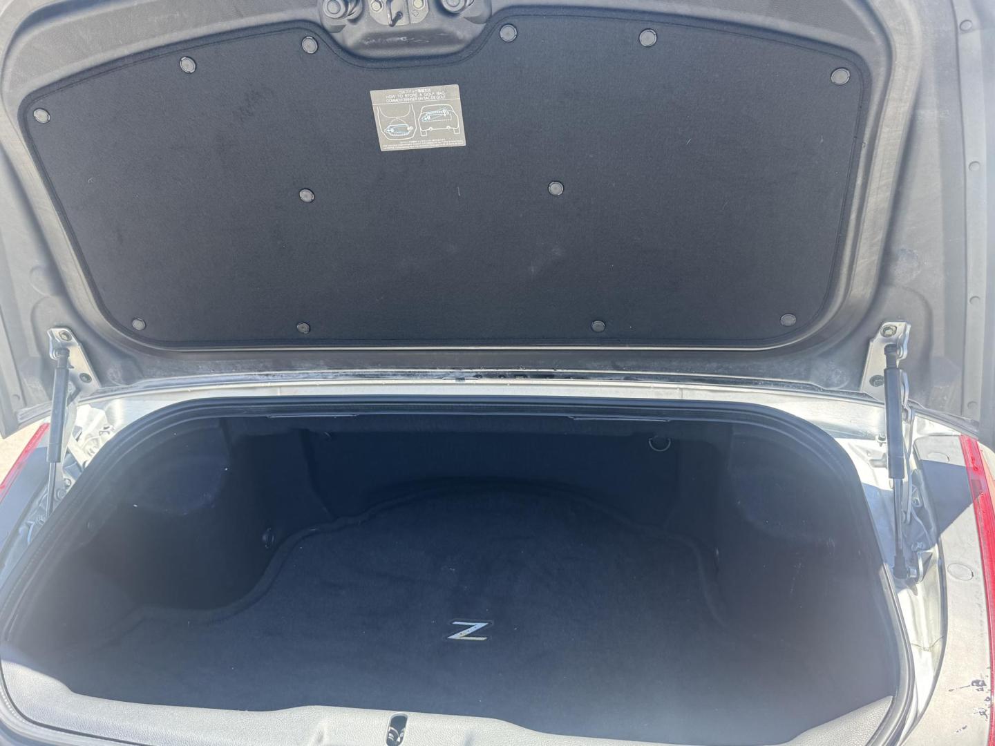 2004 Silver /black Nissan 350Z Enthusiast Roadster (JN1AZ36A74T) with an 3.5L V6 DOHC 24V engine, 6-Speed Manual Overdrive transmission, located at 2190 Hwy 95, Bullhead City, AZ, 86442, (928) 704-0060, 0.000000, 0.000000 - 2007 Nissan 350 Z convertible. Automatic . 2 owner clean carfax. Only !!!!! 25,425 original miles. Always garaged. in excellent condition. Automatic trans, electric power convertible top. tires 1 year old look like new. All maintenance records. What an amazing super clean low mileage fun car. Only - Photo#10