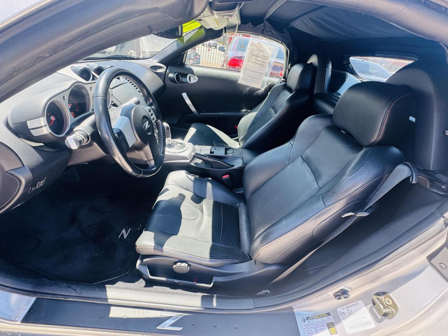 2004 Silver /black Nissan 350Z Enthusiast Roadster (JN1AZ36A74T) with an 3.5L V6 DOHC 24V engine, 6-Speed Manual Overdrive transmission, located at 2190 Hwy 95, Bullhead City, AZ, 86442, (928) 704-0060, 0.000000, 0.000000 - 2007 Nissan 350 Z convertible. Automatic . 2 owner clean carfax. Only !!!!! 25,425 original miles. Always garaged. in excellent condition. Automatic trans, electric power convertible top. tires 1 year old look like new. All maintenance records. What an amazing super clean low mileage fun car. Only - Photo#15