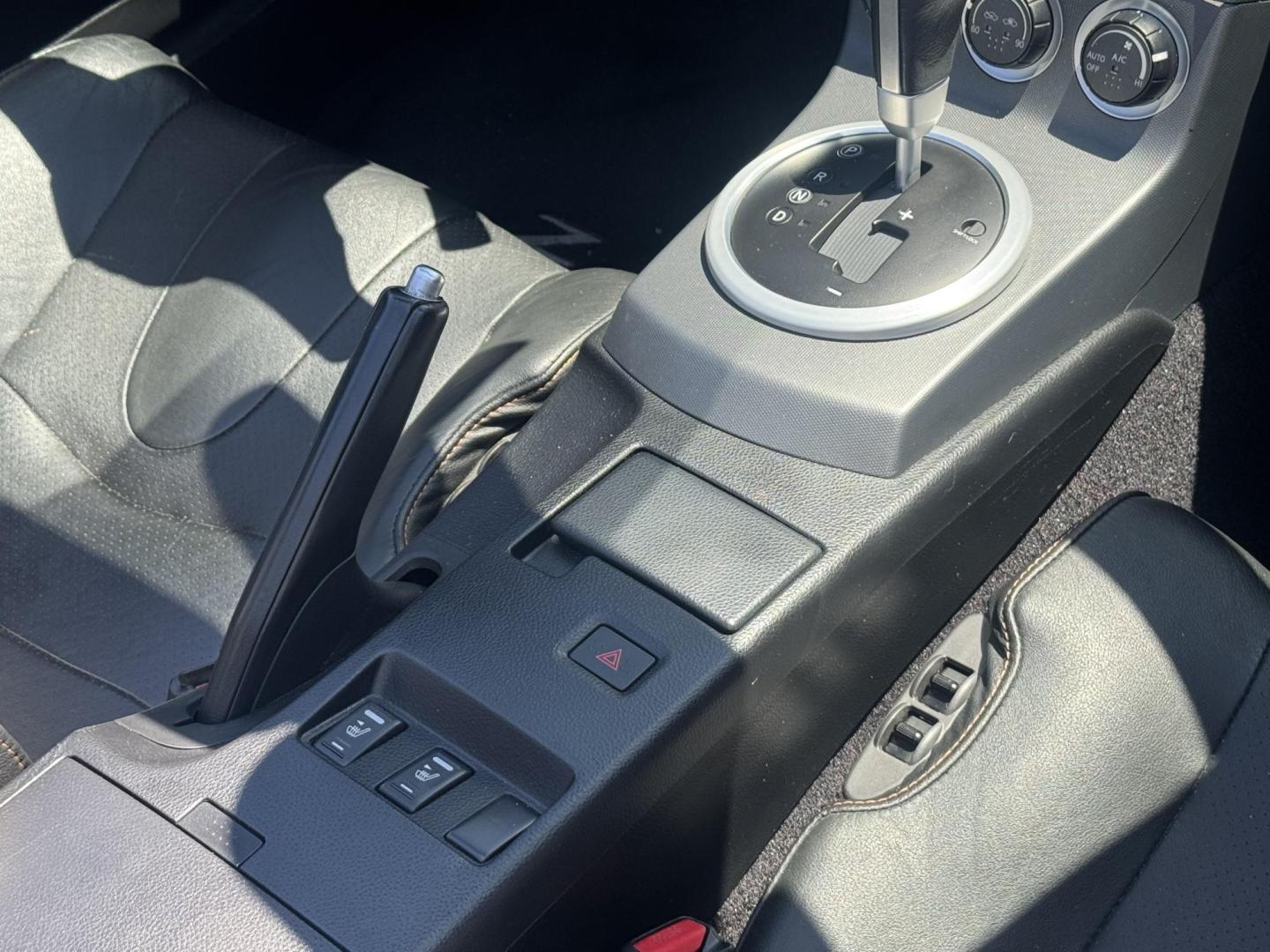 2004 Silver /black Nissan 350Z Enthusiast Roadster (JN1AZ36A74T) with an 3.5L V6 DOHC 24V engine, 6-Speed Manual Overdrive transmission, located at 2190 Hwy 95, Bullhead City, AZ, 86442, (928) 704-0060, 0.000000, 0.000000 - 2007 Nissan 350 Z convertible. Automatic . 2 owner clean carfax. Only !!!!! 25,425 original miles. Always garaged. in excellent condition. Automatic trans, electric power convertible top. tires 1 year old look like new. All maintenance records. What an amazing super clean low mileage fun car. Only - Photo#18
