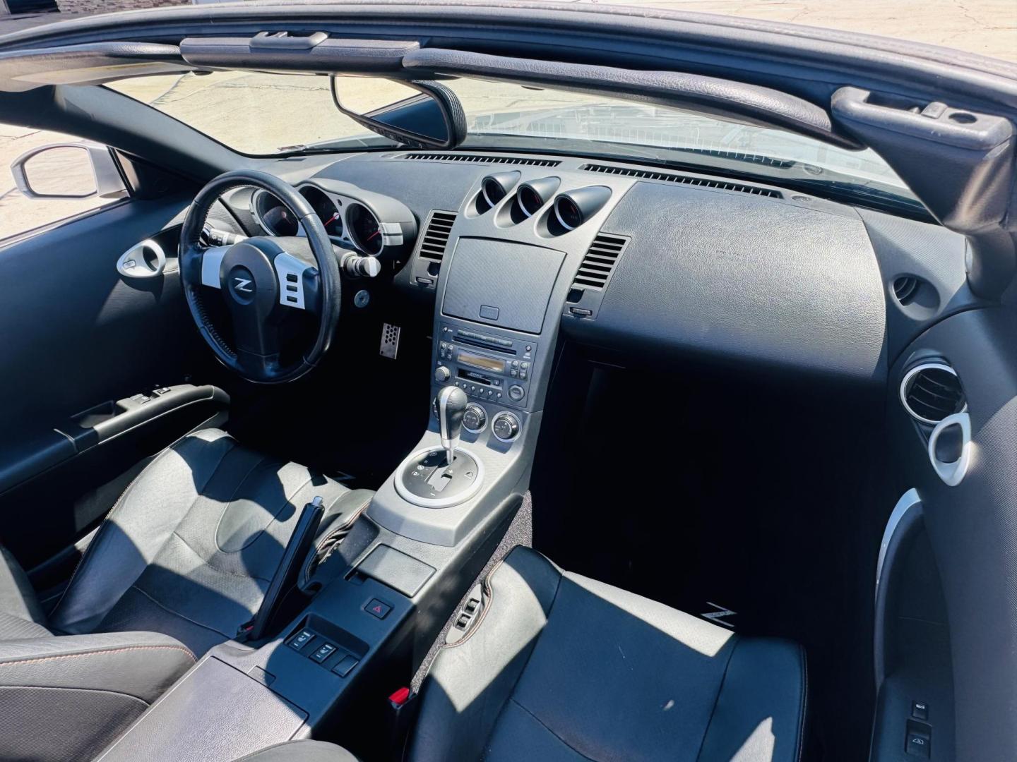 2004 Silver /black Nissan 350Z Enthusiast Roadster (JN1AZ36A74T) with an 3.5L V6 DOHC 24V engine, 6-Speed Manual Overdrive transmission, located at 2190 Hwy 95, Bullhead City, AZ, 86442, (928) 704-0060, 0.000000, 0.000000 - 2007 Nissan 350 Z convertible. Automatic . 2 owner clean carfax. Only !!!!! 25,425 original miles. Always garaged. in excellent condition. Automatic trans, electric power convertible top. tires 1 year old look like new. All maintenance records. What an amazing super clean low mileage fun car. Only - Photo#19