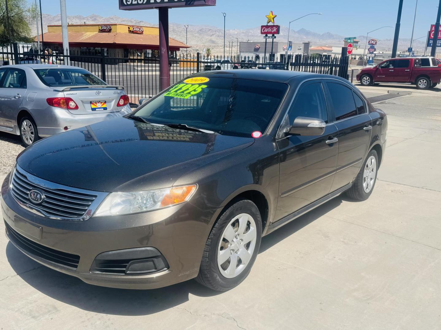 2009 Kia Optima EX (KNAGE228695) with an 2.4L L4 DOHC 16V engine, 4-Speed Automatic transmission, located at 2190 Hwy 95, Bullhead City, AZ, 86442, (928) 704-0060, 0.000000, 0.000000 - Photo#0