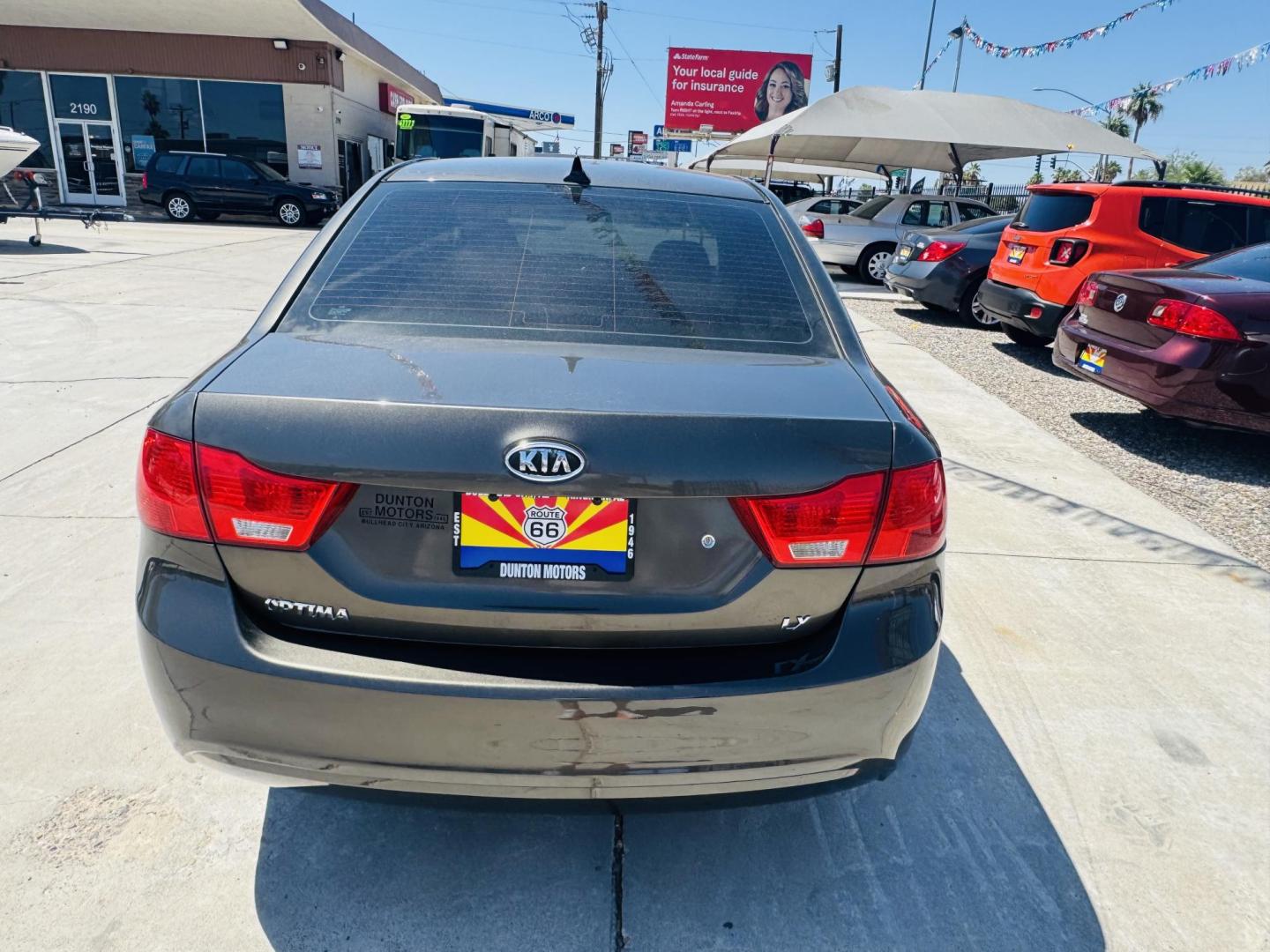 2009 Kia Optima EX (KNAGE228695) with an 2.4L L4 DOHC 16V engine, 4-Speed Automatic transmission, located at 2190 Hwy 95, Bullhead City, AZ, 86442, (928) 704-0060, 0.000000, 0.000000 - Photo#4