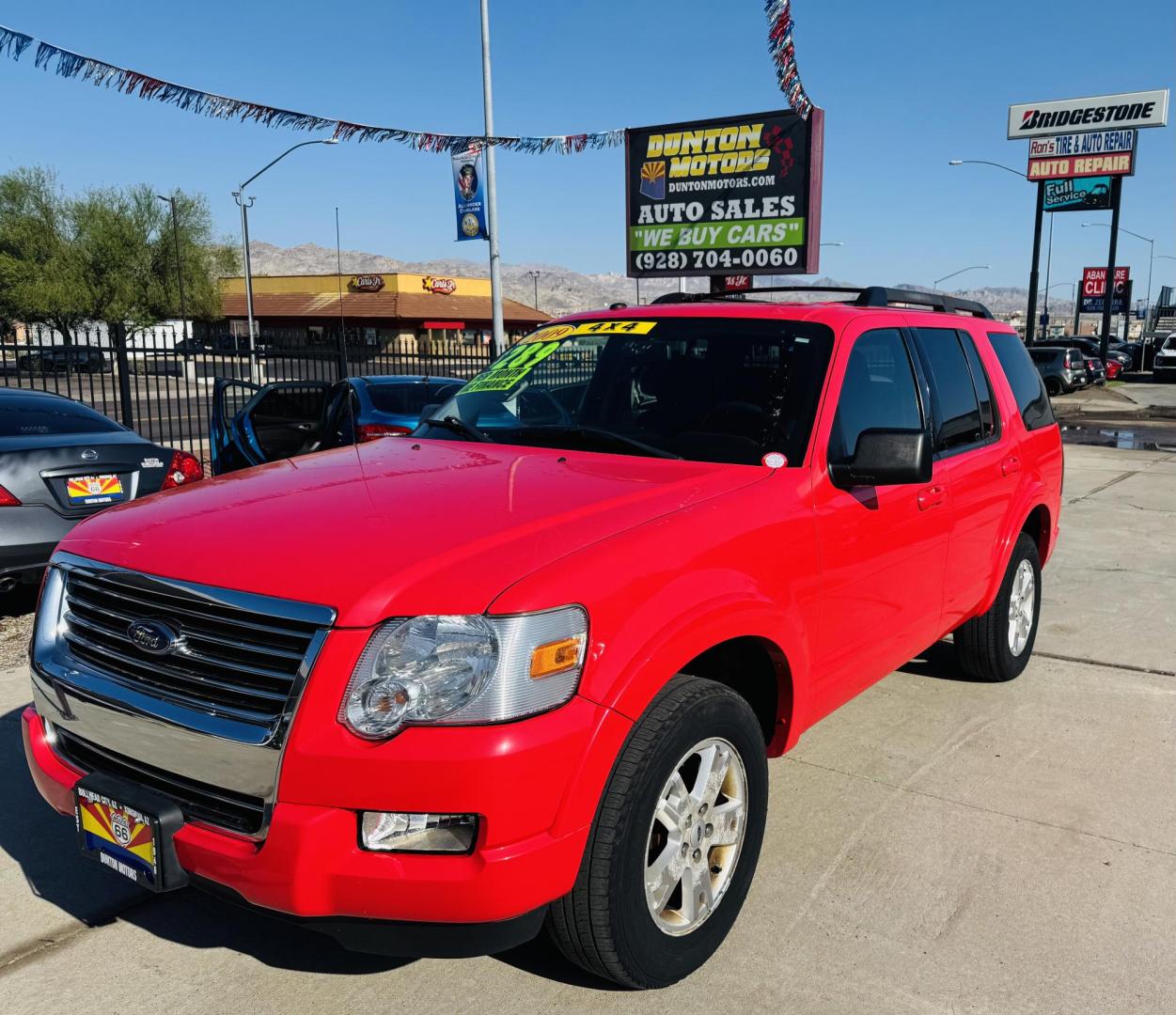 2009 Red Ford Explorer XLT 4.0L 4WD (1FMEU73E29U) with an 4.0L V6 SOHC 16V engine, 5-Speed Automatic transmission, located at 2190 Hwy 95, Bullhead City, AZ, 86442, (928) 704-0060, 0.000000, 0.000000 - 2009 Ford Explorer xlt. 4 wheel drive. Runs great. Free carfax. Free warranty. In house financing available. - Photo#2
