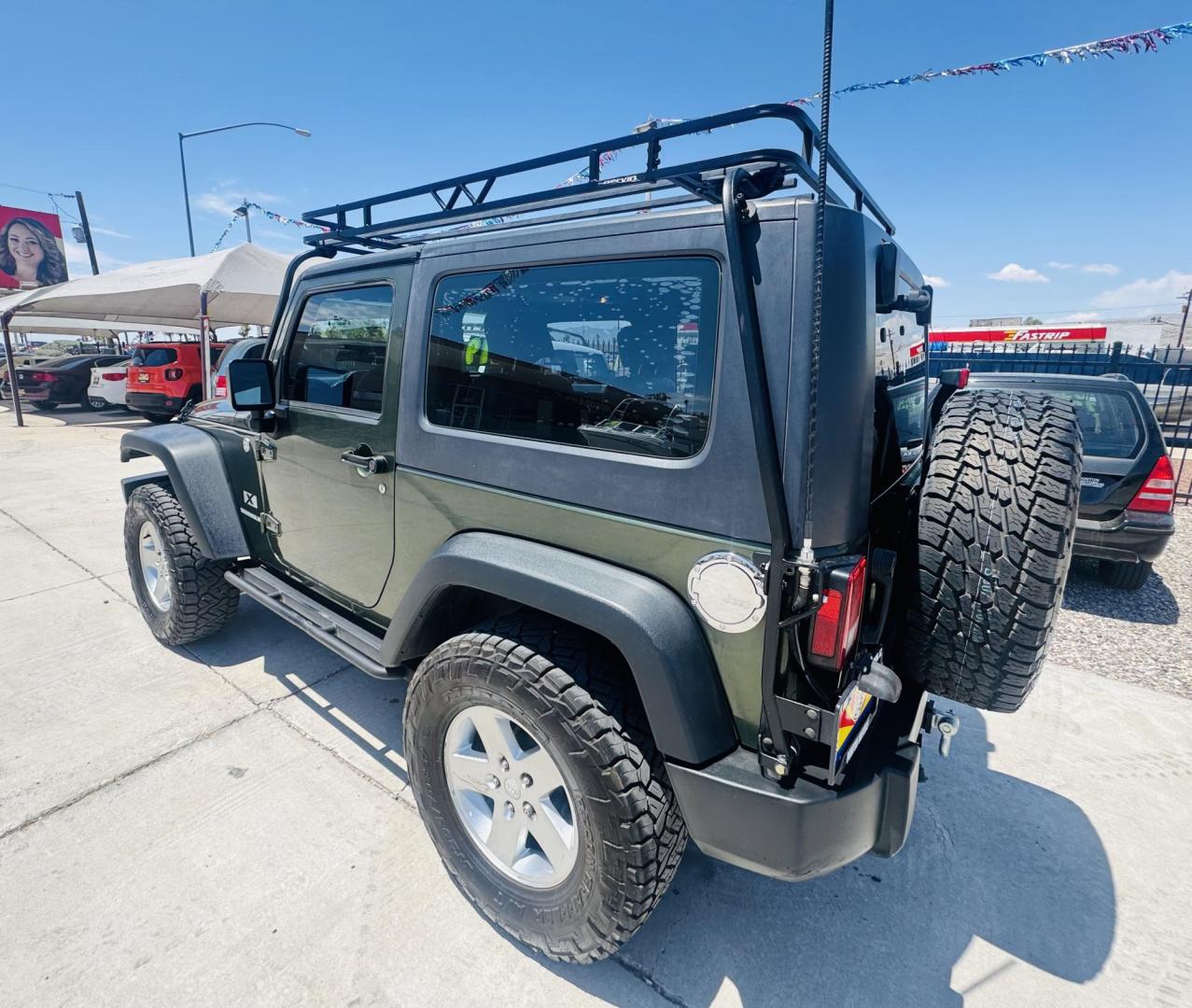 2009 Jeep Wrangler X (1J4FA24169L) with an 3.8L V6 OHV 12V engine, located at 2190 Hwy 95, Bullhead City, AZ, 86442, (928) 704-0060, 0.000000, 0.000000 - 3.8 v6 automatic. hard top. custom roof rack. Ice cold a/c. in house financing available. - Photo#6