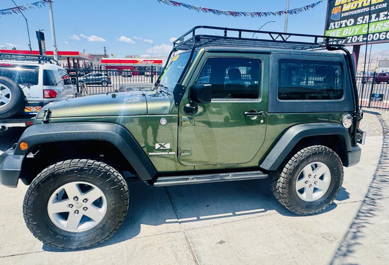 2009 Jeep Wrangler X (1J4FA24169L) with an 3.8L V6 OHV 12V engine, located at 2190 Hwy 95, Bullhead City, AZ, 86442, (928) 704-0060, 0.000000, 0.000000 - 3.8 v6 automatic. hard top. custom roof rack. Ice cold a/c. in house financing available. - Photo#9