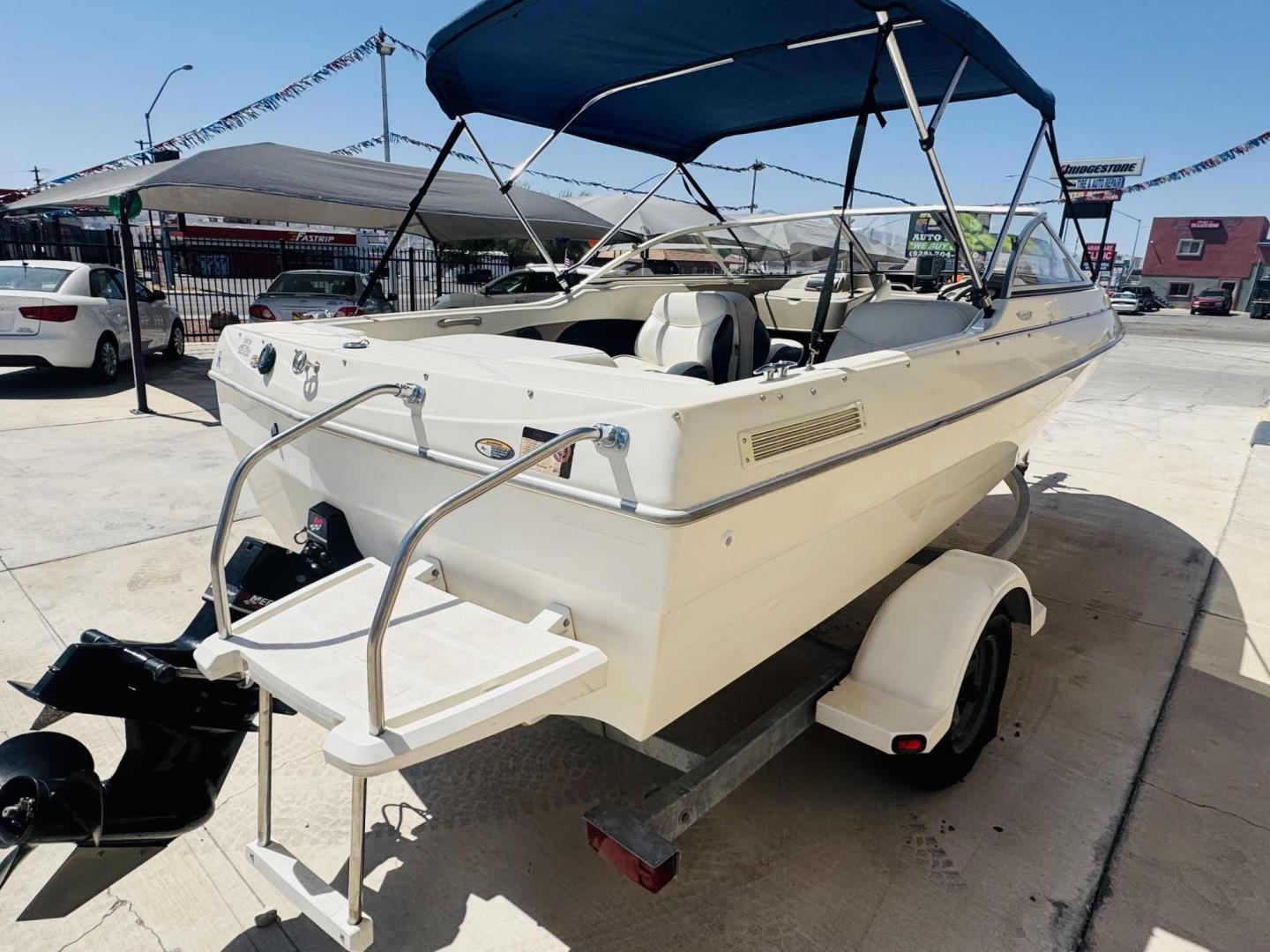 2001 White Bayliner Capri 190 , located at 2190 Hwy 95, Bullhead City, AZ, 86442, (928) 704-0060, 0.000000, 0.000000 - 2001 Bayliner Capri 1950 classic. Super clean 3.0 Mercruiser. recently serviced. seats up to 9. new bimini top . new boat cover. Runs and drives great. recently serviced. full spare tire/rim for trailer. tags current. seats and interior super nice. great entry boat. rear swim deck. cd player. - Photo#0