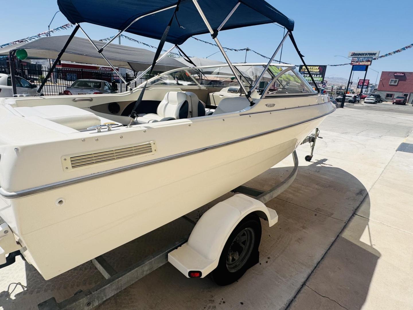 2001 White Bayliner Capri 190 , located at 2190 Hwy 95, Bullhead City, AZ, 86442, (928) 704-0060, 0.000000, 0.000000 - 2001 Bayliner Capri 1950 classic. Super clean 3.0 Mercruiser. recently serviced. seats up to 9. new bimini top . new boat cover. Runs and drives great. recently serviced. full spare tire/rim for trailer. tags current. seats and interior super nice. great entry boat. rear swim deck. cd player. - Photo#6