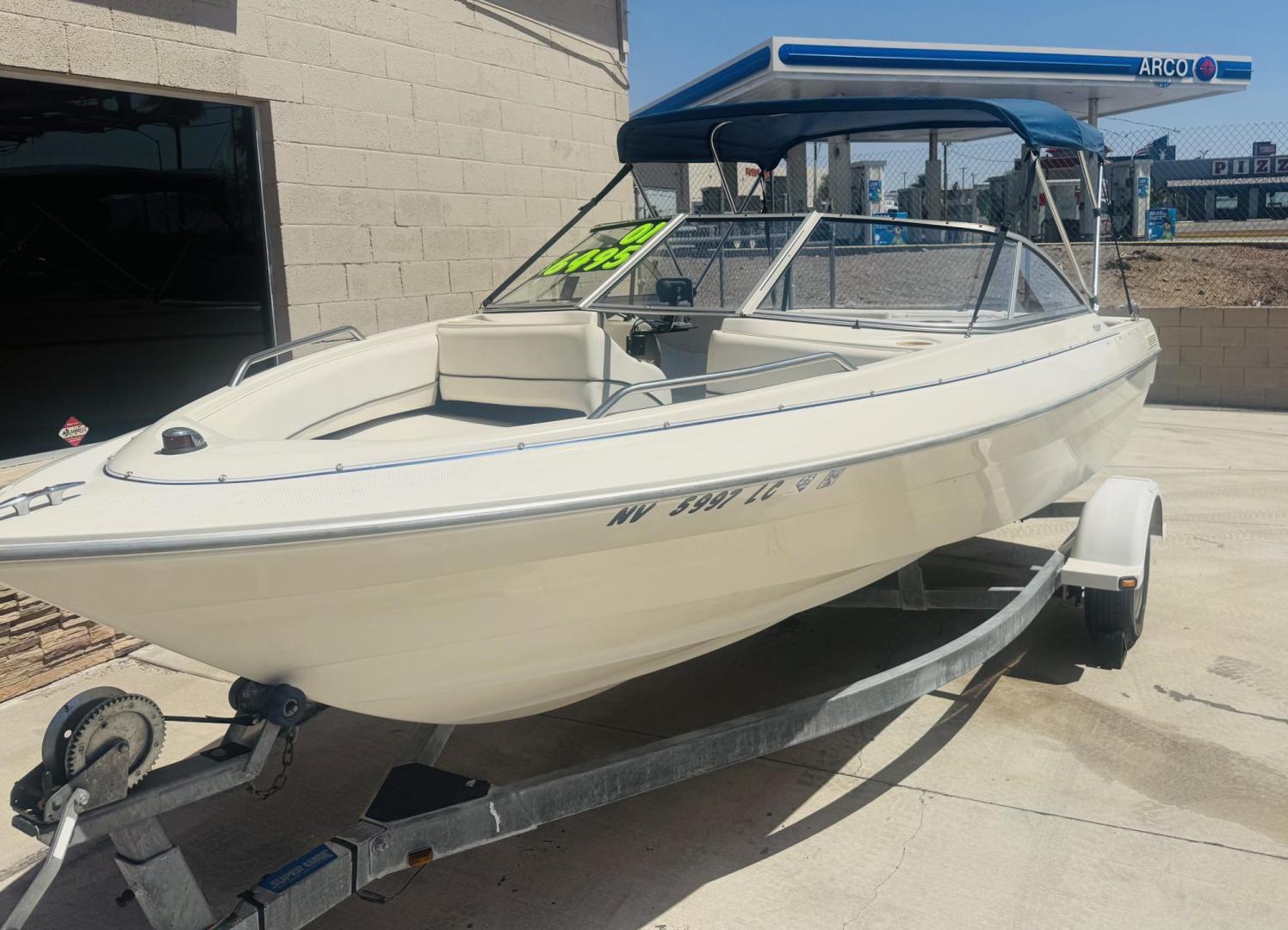 2001 White Bayliner Capri 190 , located at 2190 Hwy 95, Bullhead City, AZ, 86442, (928) 704-0060, 0.000000, 0.000000 - 2001 Bayliner Capri 1950 classic. Super clean 3.0 Mercruiser. recently serviced. seats up to 9. new bimini top . new boat cover. Runs and drives great. recently serviced. full spare tire/rim for trailer. tags current. seats and interior super nice. great entry boat. rear swim deck. cd player. - Photo#4