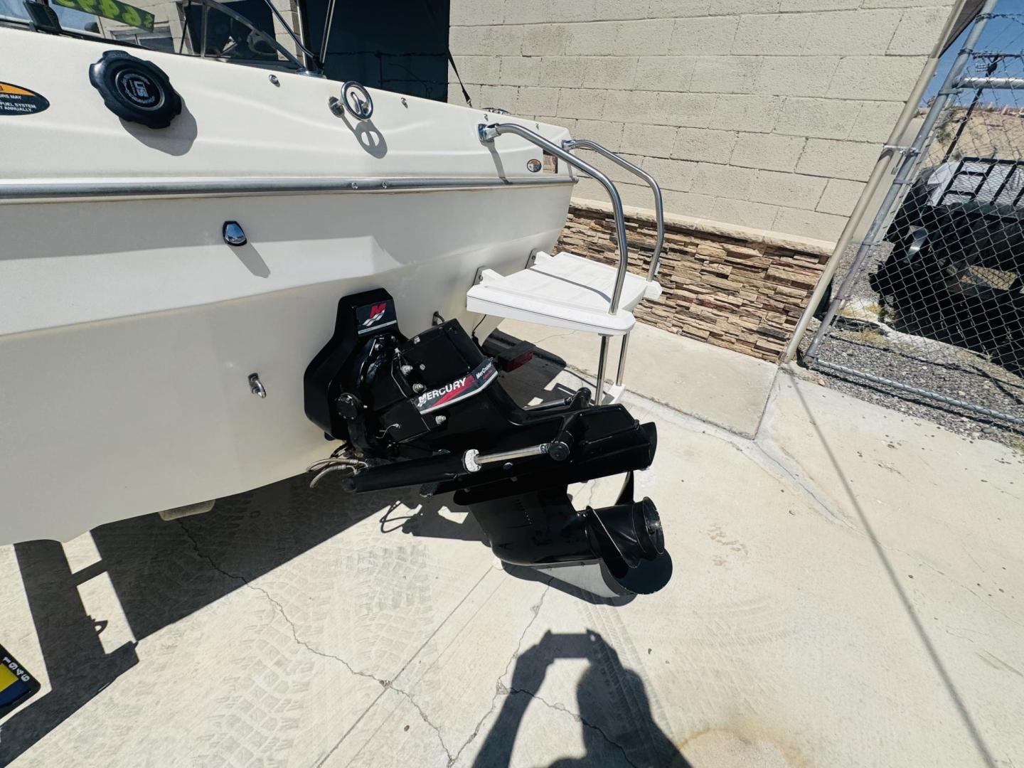 2001 White Bayliner Capri 190 , located at 2190 Hwy 95, Bullhead City, AZ, 86442, (928) 704-0060, 0.000000, 0.000000 - 2001 Bayliner Capri 1950 classic. Super clean 3.0 Mercruiser. recently serviced. seats up to 9. new bimini top . new boat cover. Runs and drives great. recently serviced. full spare tire/rim for trailer. tags current. seats and interior super nice. great entry boat. rear swim deck. cd player. - Photo#7