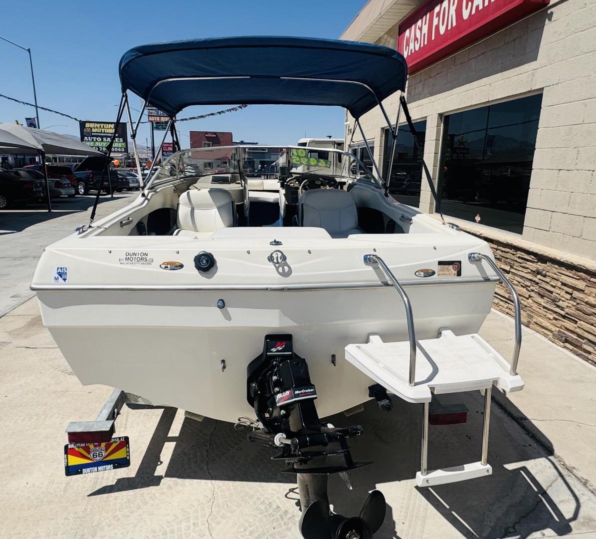 2001 White Bayliner Capri 190 , located at 2190 Hwy 95, Bullhead City, AZ, 86442, (928) 704-0060, 0.000000, 0.000000 - 2001 Bayliner Capri 1950 classic. Super clean 3.0 Mercruiser. recently serviced. seats up to 9. new bimini top . new boat cover. Runs and drives great. recently serviced. full spare tire/rim for trailer. tags current. seats and interior super nice. great entry boat. rear swim deck. cd player. - Photo#9