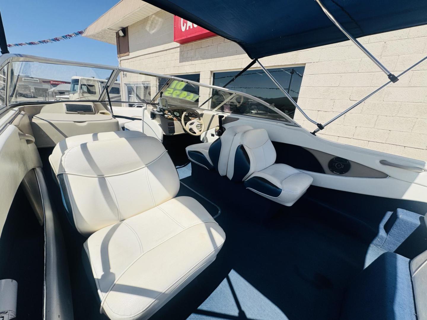 2001 White Bayliner Capri 190 , located at 2190 Hwy 95, Bullhead City, AZ, 86442, (928) 704-0060, 0.000000, 0.000000 - 2001 Bayliner Capri 1950 classic. Super clean 3.0 Mercruiser. recently serviced. seats up to 9. new bimini top . new boat cover. Runs and drives great. recently serviced. full spare tire/rim for trailer. tags current. seats and interior super nice. great entry boat. rear swim deck. cd player. - Photo#11