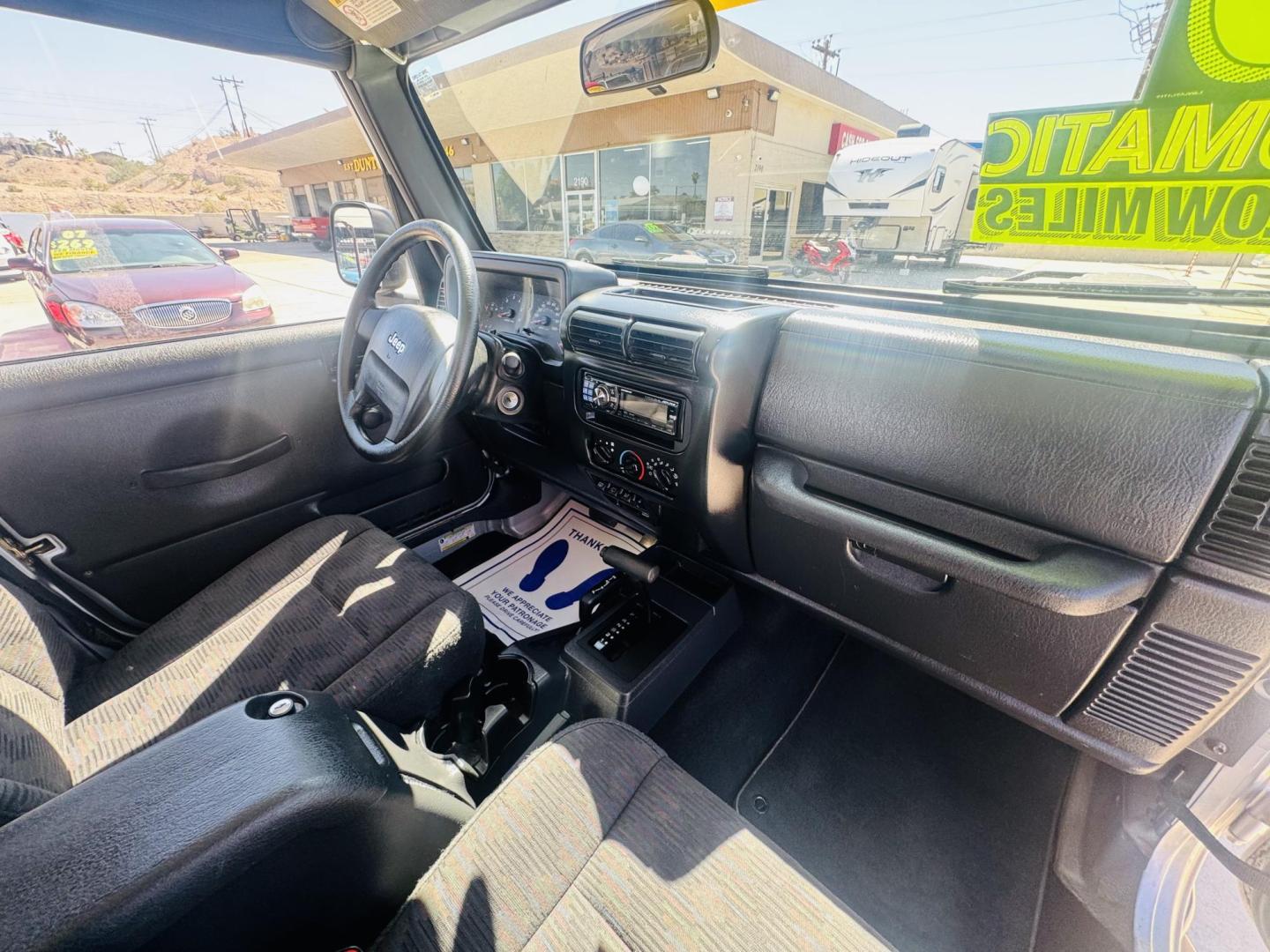 2005 Silver Jeep Wrangler Sport (1J4FA49S15P) with an 4.0L L6 OHV 12V engine, located at 2190 Hwy 95, Bullhead City, AZ, 86442, (928) 704-0060, 0.000000, 0.000000 - 2005 Jeep wrangler Sport. Automatic 4.0 V6. hard top , hard doors. ice cold a/c. brand new windshield. super super low original miles. Only 46,000. Arizona title. Free and clear . - Photo#5