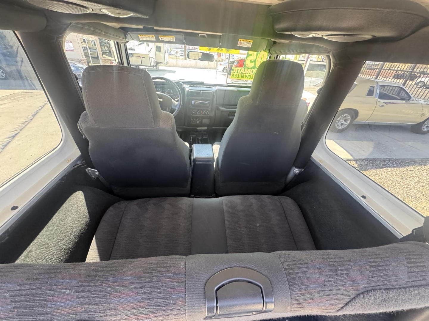 2005 Silver Jeep Wrangler Sport (1J4FA49S15P) with an 4.0L L6 OHV 12V engine, located at 2190 Hwy 95, Bullhead City, AZ, 86442, (928) 704-0060, 0.000000, 0.000000 - 2005 Jeep wrangler Sport. Automatic 4.0 V6. hard top , hard doors. ice cold a/c. brand new windshield. super super low original miles. Only 46,000. Arizona title. Free and clear . - Photo#7