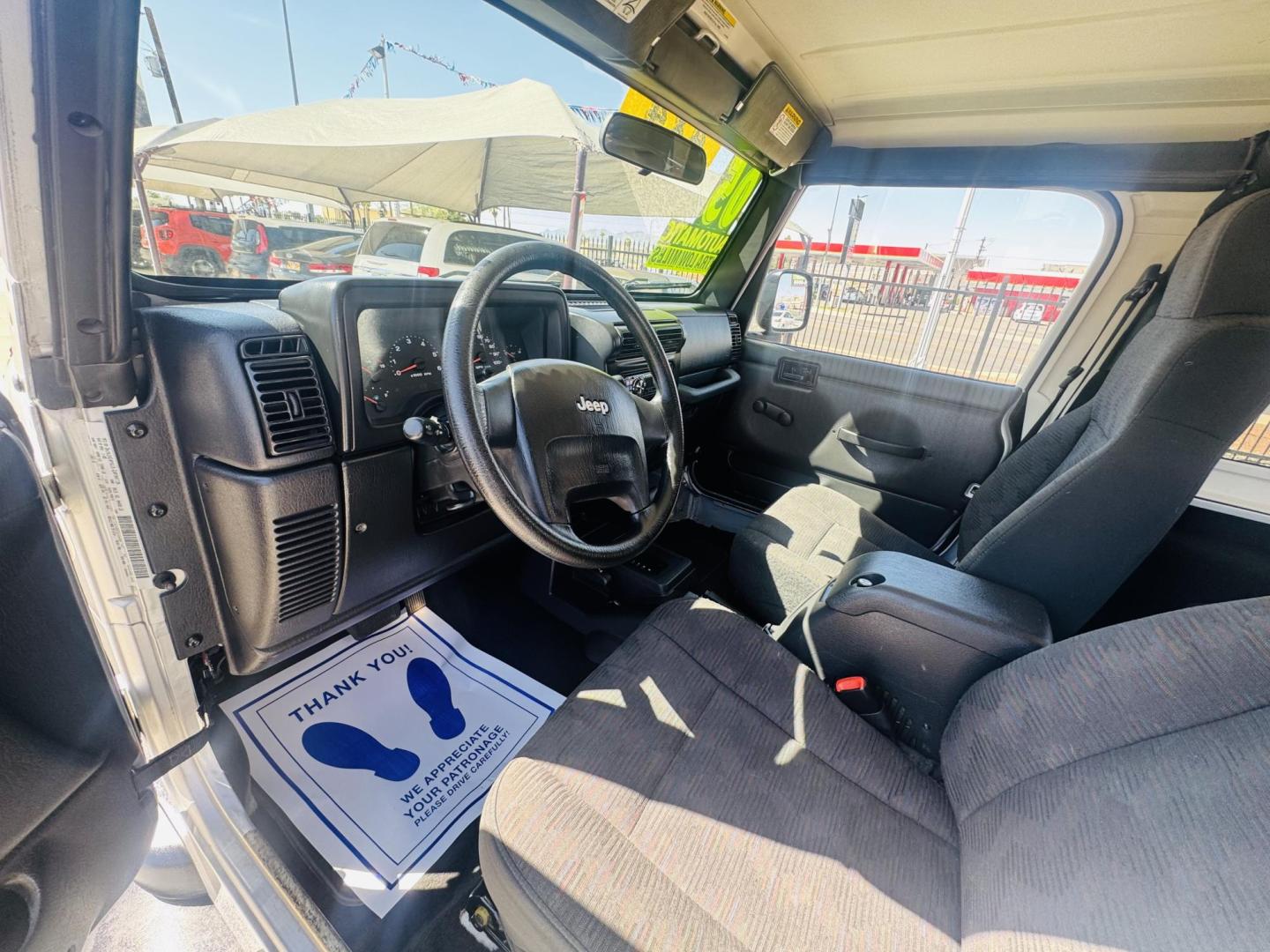 2005 Silver Jeep Wrangler Sport (1J4FA49S15P) with an 4.0L L6 OHV 12V engine, located at 2190 Hwy 95, Bullhead City, AZ, 86442, (928) 704-0060, 0.000000, 0.000000 - 2005 Jeep wrangler Sport. Automatic 4.0 V6. hard top , hard doors. ice cold a/c. brand new windshield. super super low original miles. Only 46,000. Arizona title. Free and clear . - Photo#14