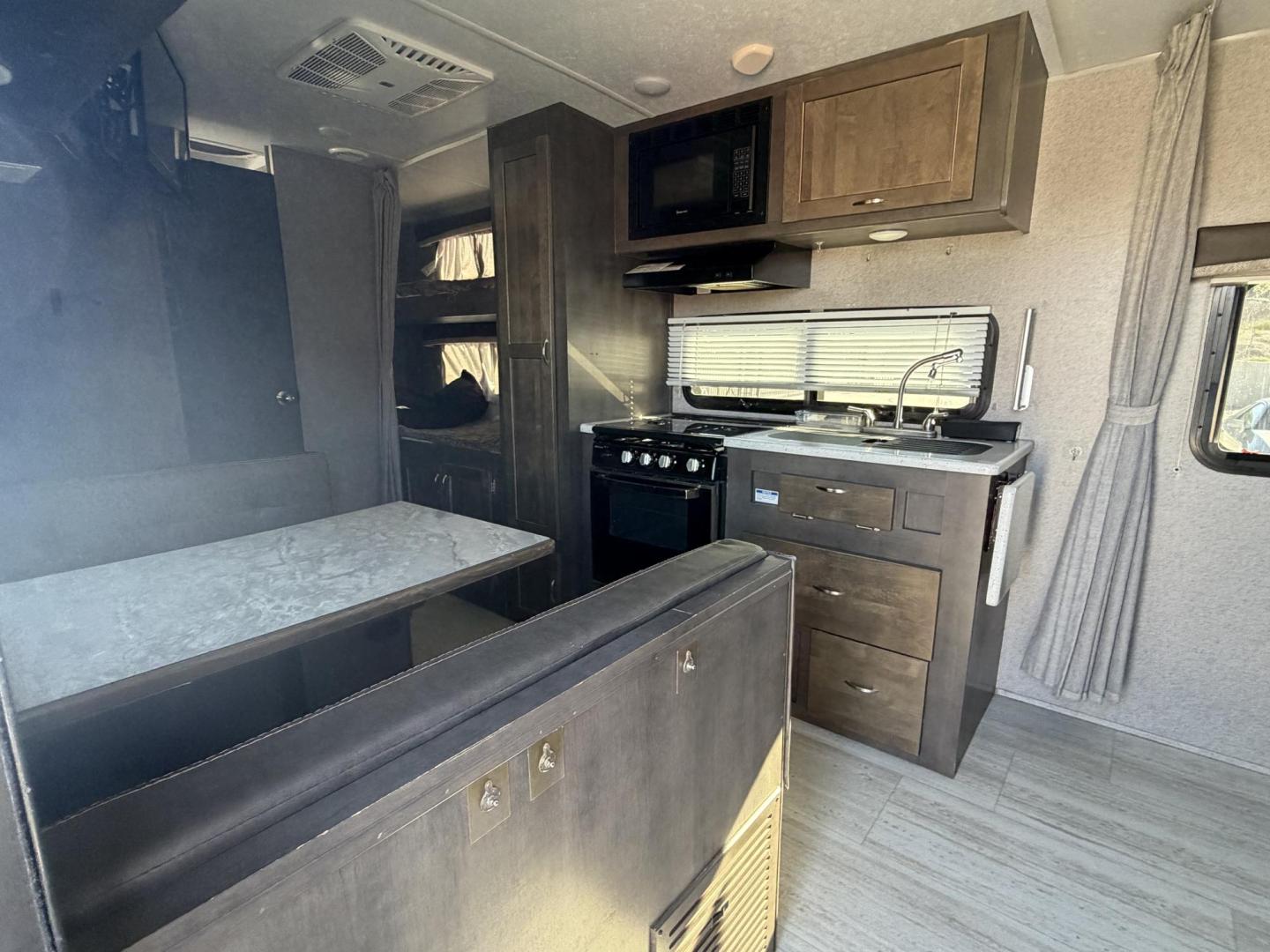 2019 White Forest River Rockwood Mini Lite 2306 - (4X4TRLY27KD) , located at 2190 Hwy 95, Bullhead City, AZ, 86442, (928) 704-0060, 0.000000, 0.000000 - On consignment, This super clean 2019 Forest River Rockwood 2306 travel trailer. Mini Lite. 23 ft. Electric tongue jack. 2 new batteries. electric awning. led lighting . sleeps 6. can easily be towed with half ton truck or suv. GVWR is 2660 lbs. has front folding bed. two bunk beds on side and dini - Photo#22