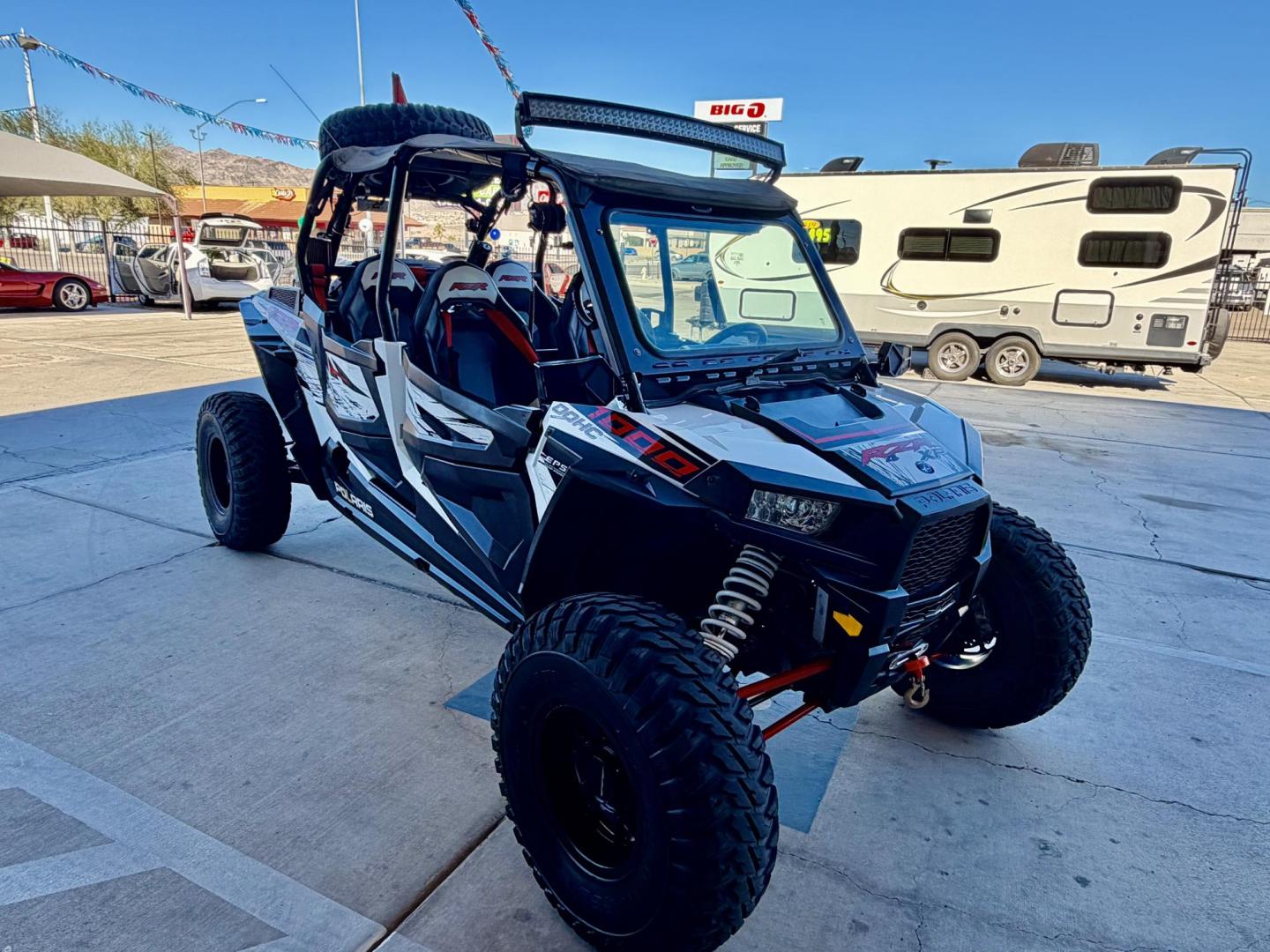 2014 Red Polaris Unknown - (4XA6T1EA2EB) , located at 2190 Hwy 95, Bullhead City, AZ, 86442, (928) 704-0060, 0.000000, 0.000000 - 2014 Polaris Rzr4 xp 1000. lots of extras, oversized tires. hard full windshield. soft top, spare tire w carrier. polaris gps screen and stereo system. WINCH,LIGHTS, WHIP BAR,THIS THING HAS TONS OF EXTRAS. Runs and drive great. Free and clear arizona title. - Photo#9