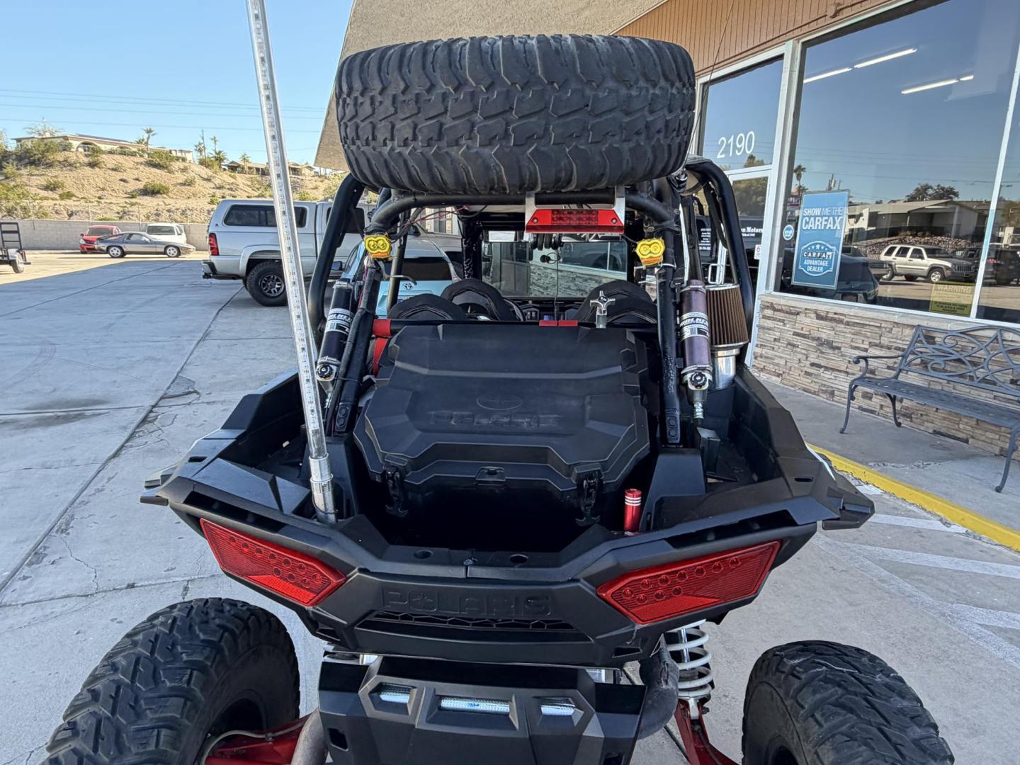 2014 Red Polaris Unknown - (4XA6T1EA2EB) , located at 2190 Hwy 95, Bullhead City, AZ, 86442, (928) 704-0060, 0.000000, 0.000000 - 2014 Polaris Rzr4 xp 1000. lots of extras, oversized tires. hard full windshield. soft top, spare tire w carrier. polaris gps screen and stereo system. WINCH,LIGHTS, WHIP BAR,THIS THING HAS TONS OF EXTRAS. Runs and drive great. Free and clear arizona title. - Photo#12