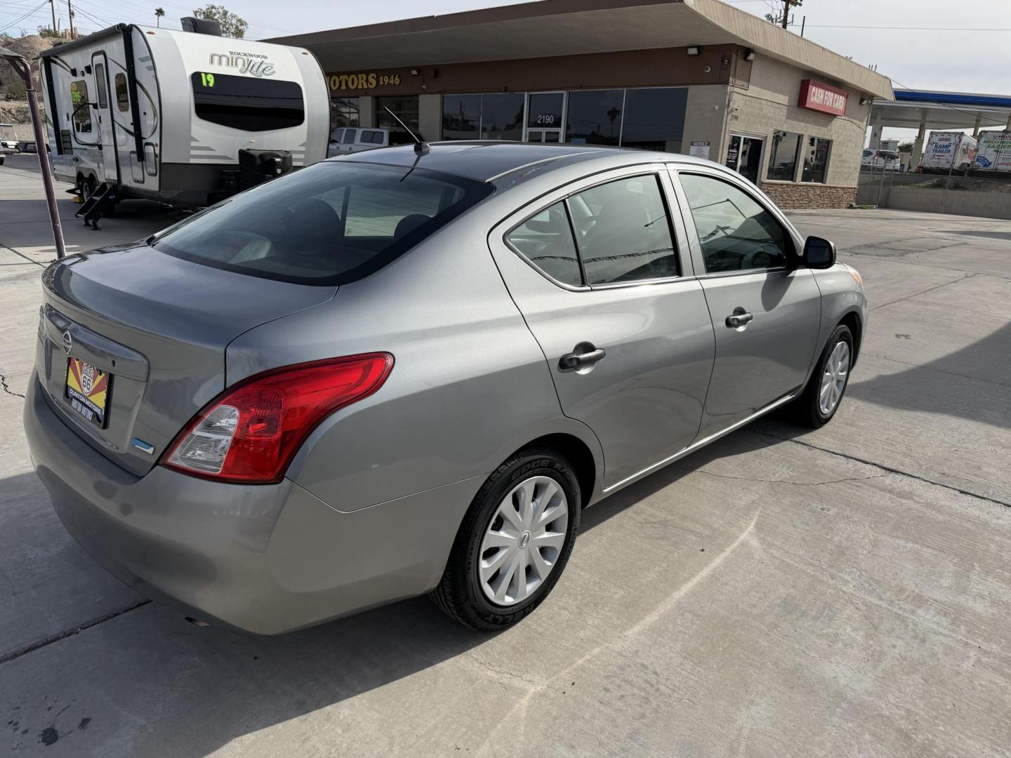 2014 Charcoal Nissan Versa 1.6 S 5M (3N1CN7AP8EL) with an 1.6L L4 DOHC 16V engine, 5-Speed Manual transmission, located at 2190 Hwy 95, Bullhead City, AZ, 86442, (928) 704-0060, 0.000000, 0.000000 - 2014 Nissan Versa S. Only 84k miles ice cold ac . Manual transmission. Great gas saver and commuter car . Low miles for the year . We finance , free warranty , free CARFAX - Photo#5