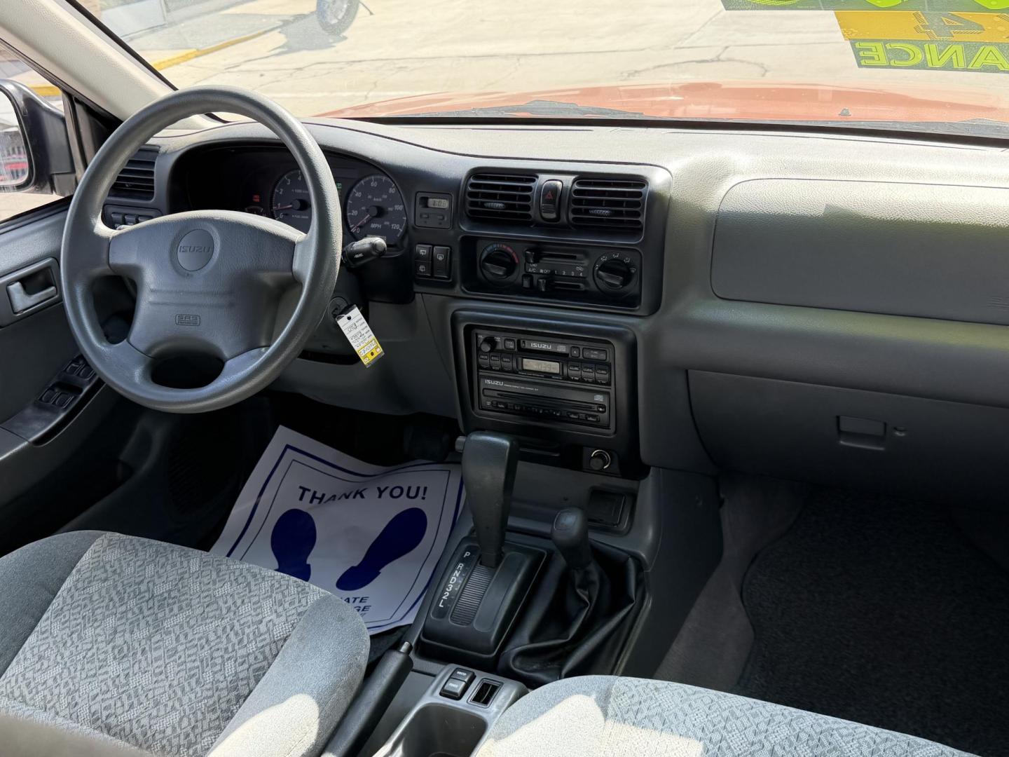 2000 Orange metallic /Grey Isuzu Rodeo LS , located at 2190 Hwy 95, Bullhead City, AZ, 86442, (928) 704-0060, 0.000000, 0.000000 - 2000 Isuzu rodeo . S . 3.2 v6 automatic , power windows locks cold ac . 4 wheel drive . In house financing available - Photo#7