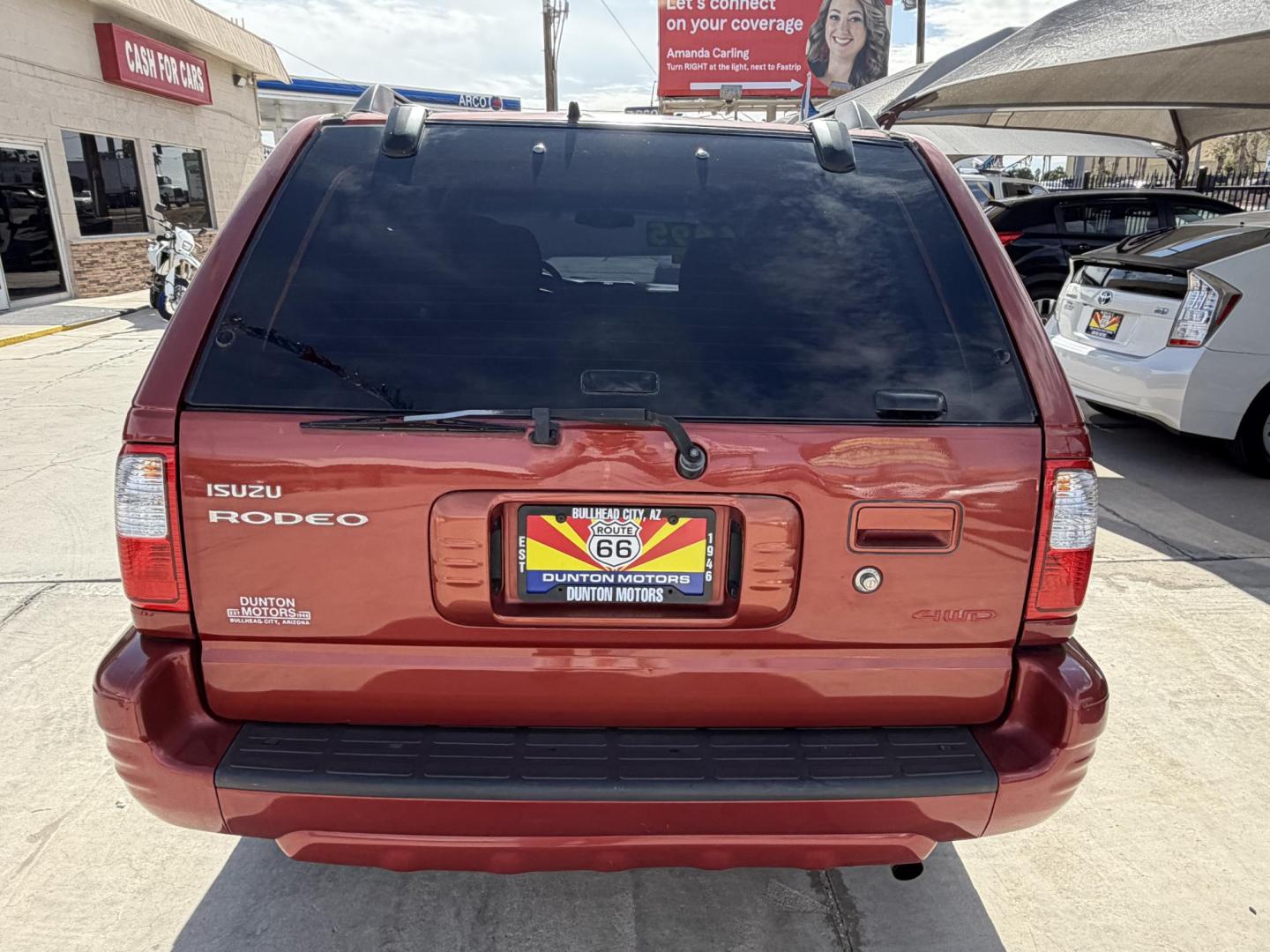 2000 Orange metallic /Grey Isuzu Rodeo LS , located at 2190 Hwy 95, Bullhead City, AZ, 86442, (928) 704-0060, 0.000000, 0.000000 - 2000 Isuzu rodeo . S . 3.2 v6 automatic , power windows locks cold ac . 4 wheel drive . In house financing available - Photo#8