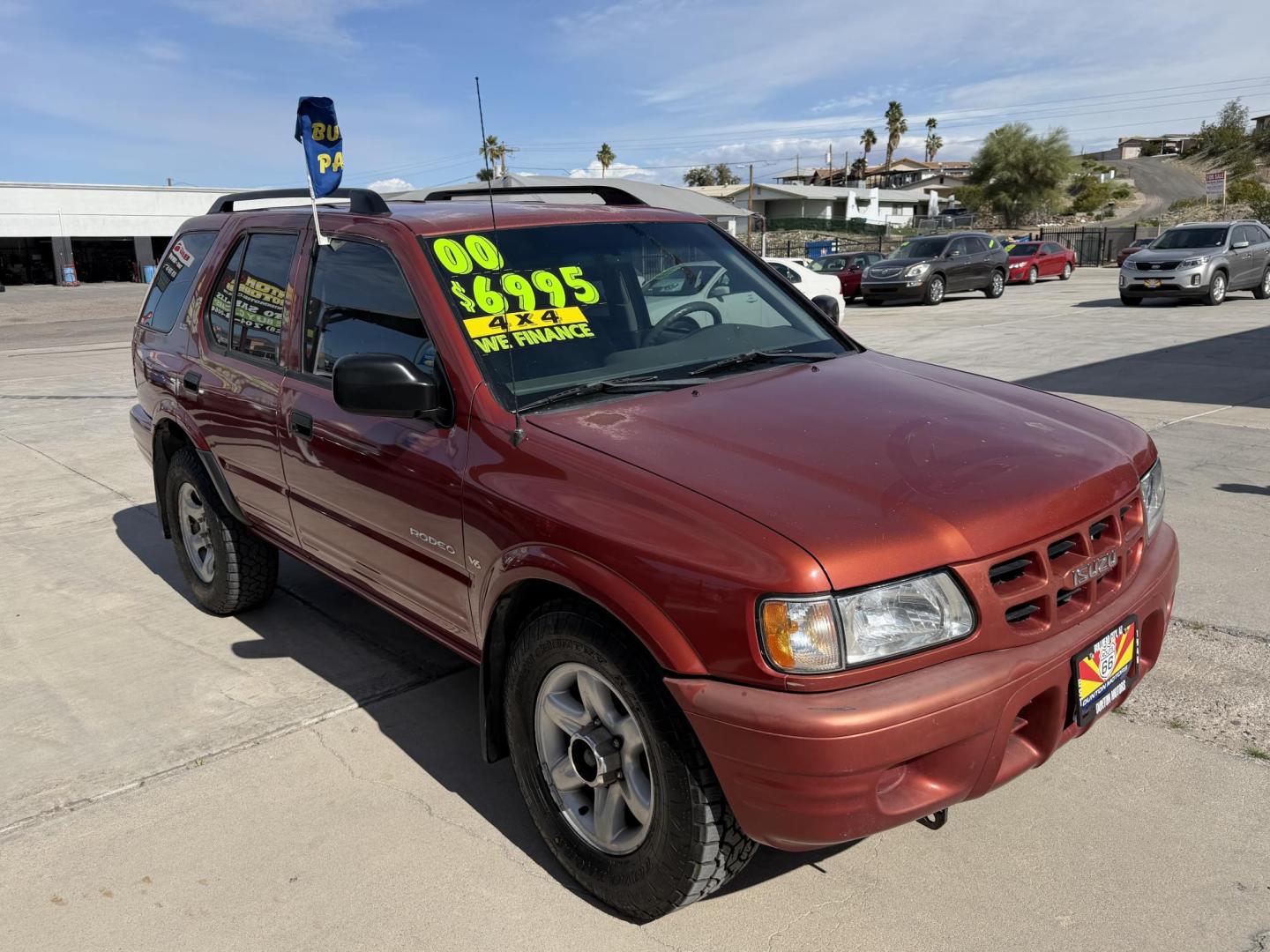 2000 Orange metallic /Grey Isuzu Rodeo LS , located at 2190 Hwy 95, Bullhead City, AZ, 86442, (928) 704-0060, 0.000000, 0.000000 - 2000 Isuzu rodeo . S . 3.2 v6 automatic , power windows locks cold ac . 4 wheel drive . In house financing available - Photo#10