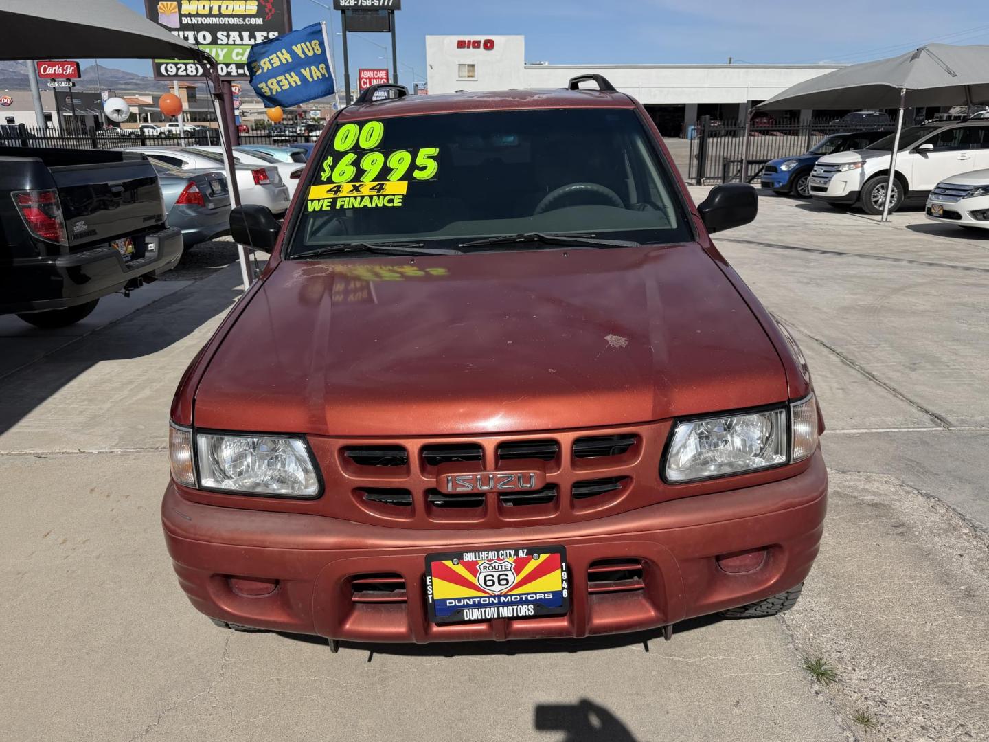 2000 Orange metallic /Grey Isuzu Rodeo LS , located at 2190 Hwy 95, Bullhead City, AZ, 86442, (928) 704-0060, 0.000000, 0.000000 - 2000 Isuzu rodeo . S . 3.2 v6 automatic , power windows locks cold ac . 4 wheel drive . In house financing available - Photo#11