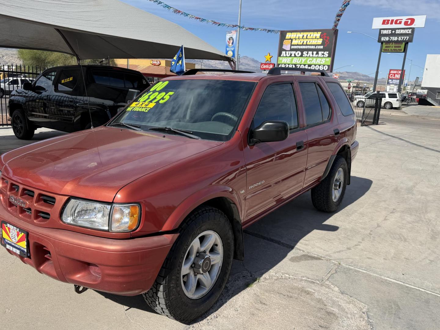 2000 Orange metallic /Grey Isuzu Rodeo LS , located at 2190 Hwy 95, Bullhead City, AZ, 86442, (928) 704-0060, 0.000000, 0.000000 - 2000 Isuzu rodeo . S . 3.2 v6 automatic , power windows locks cold ac . 4 wheel drive . In house financing available - Photo#12