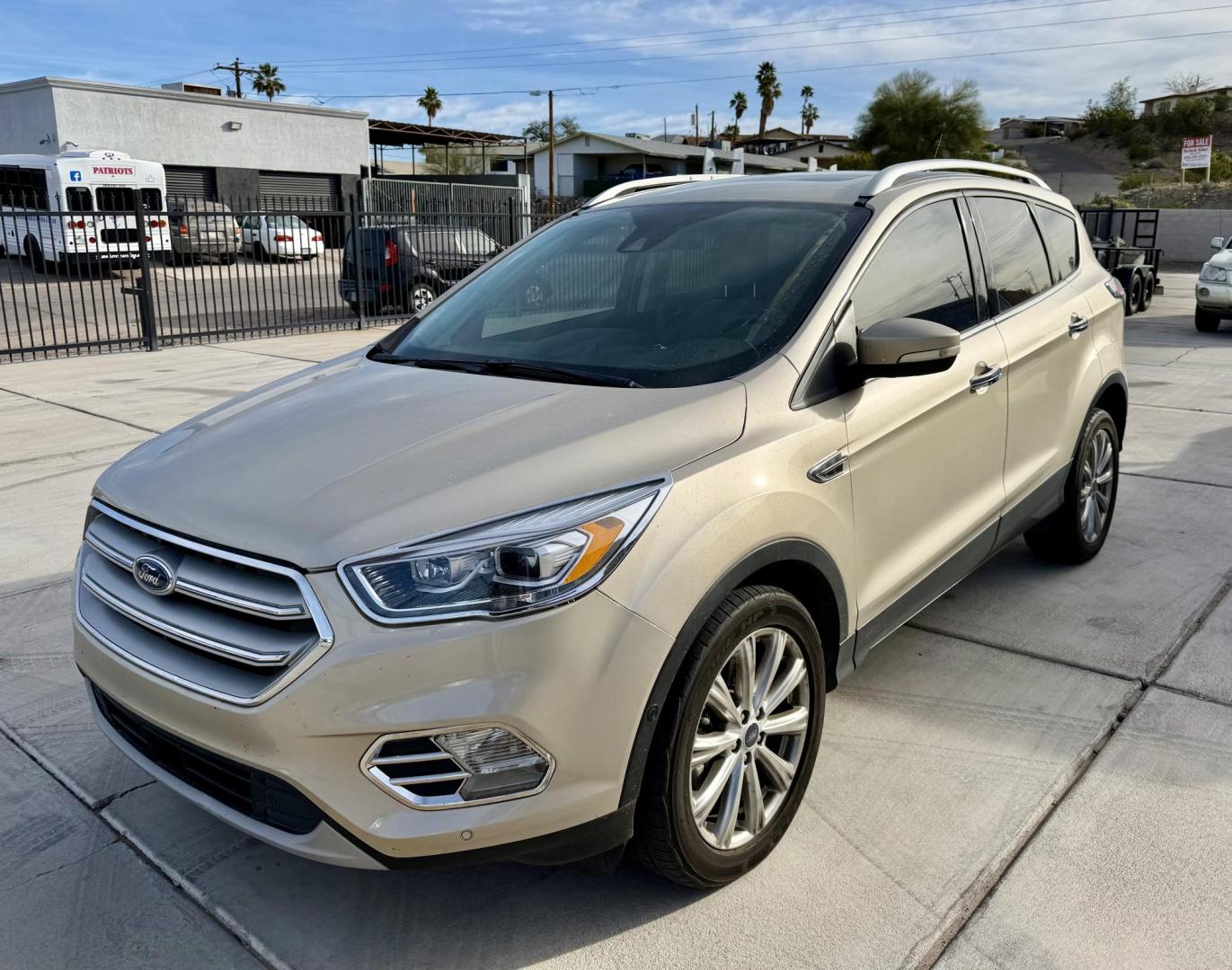 2018 Bronze /Grey Ford Escape Titanium FWD (1FMCU0J96JU) with an 2.0L L4 DOHC 16V engine, 6A transmission, located at 2190 Hwy 95, Bullhead City, AZ, 86442, (928) 704-0060, 0.000000, 0.000000 - 2018 Ford Escape Titanium. Leather, loaded. super clean. bluetooth, backup camera, top of the line. . free warranty. free carfax. we finance. in house financing. - Photo#0