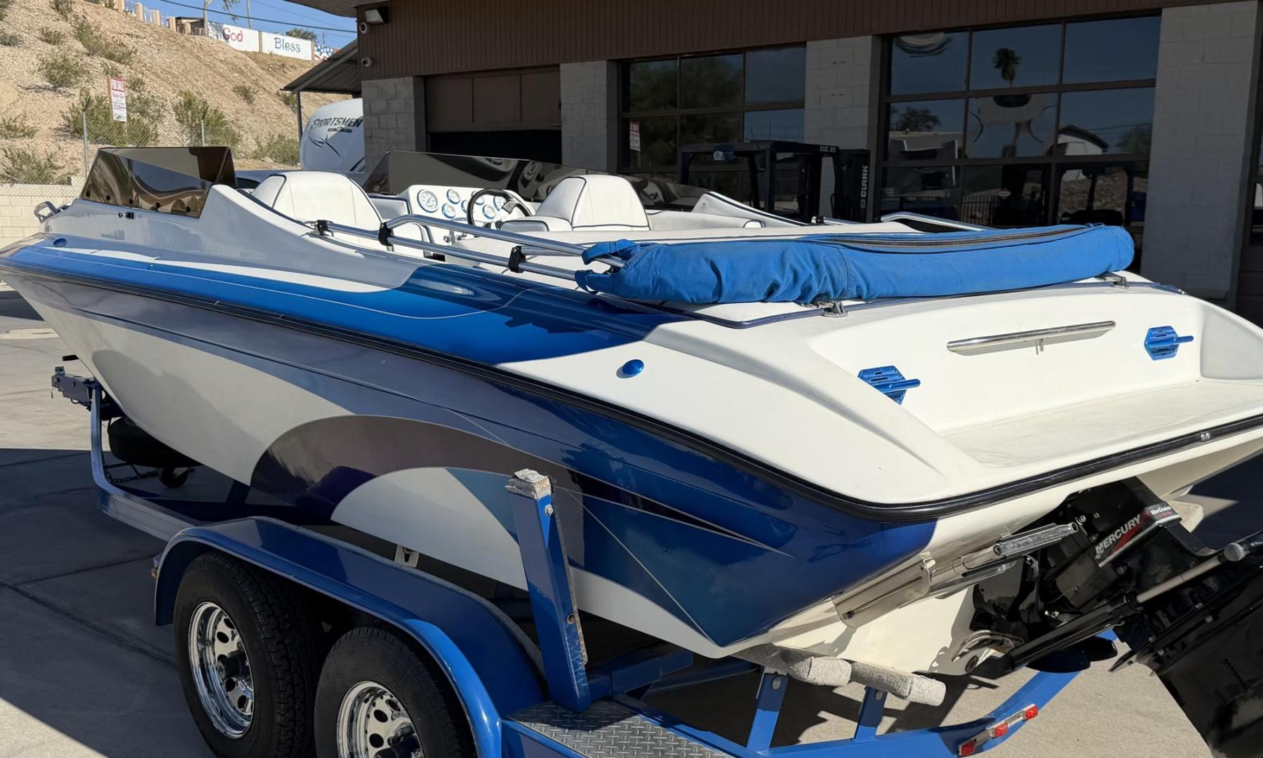 2001 White /white/blue Galaxie Starion 2150 , located at 2190 Hwy 95, Bullhead City, AZ, 86442, (928) 704-0060, 0.000000, 0.000000 - On consignment. This super clean 2001 Galaxie Starion 2150 boat. 5.7 V8 engine. 1 owner. only 248 hours. Always garaged since new. Just serviced. trailer included. Alpha 1 outdirve. spacious seaing layout. bimini top . swim platform stereo. upholstery in great shape. always maintained. Runs excellen - Photo#1