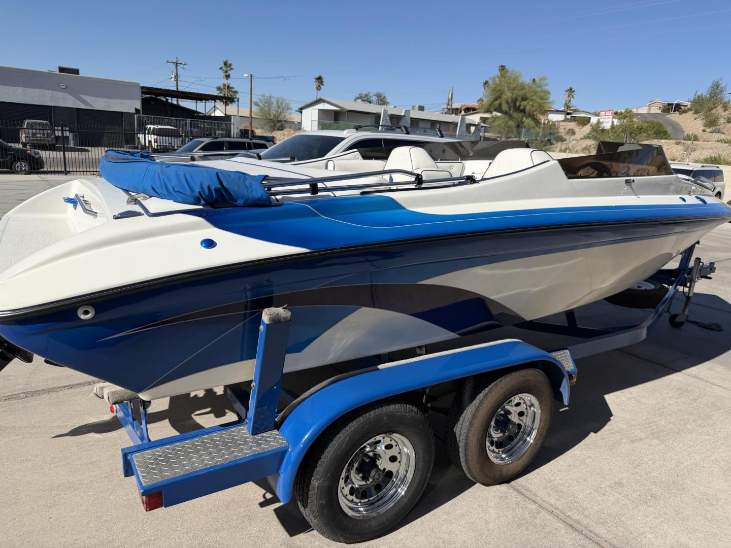 2001 White /white/blue Galaxie Starion 2150 , located at 2190 Hwy 95, Bullhead City, AZ, 86442, (928) 704-0060, 0.000000, 0.000000 - On consignment. This super clean 2001 Galaxie Starion 2150 boat. 5.7 V8 engine. 1 owner. only 248 hours. Always garaged since new. Just serviced. trailer included. Alpha 1 outdirve. spacious seaing layout. bimini top . swim platform stereo. upholstery in great shape. always maintained. Runs excellen - Photo#2
