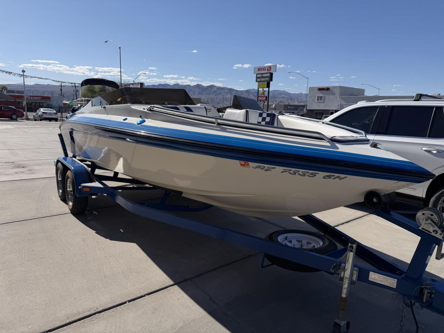 2001 White /white/blue Galaxie Starion 2150 , located at 2190 Hwy 95, Bullhead City, AZ, 86442, (928) 704-0060, 0.000000, 0.000000 - On consignment. This super clean 2001 Galaxie Starion 2150 boat. 5.7 V8 engine. 1 owner. only 248 hours. Always garaged since new. Just serviced. trailer included. Alpha 1 outdirve. spacious seaing layout. bimini top . swim platform stereo. upholstery in great shape. always maintained. Runs excellen - Photo#6
