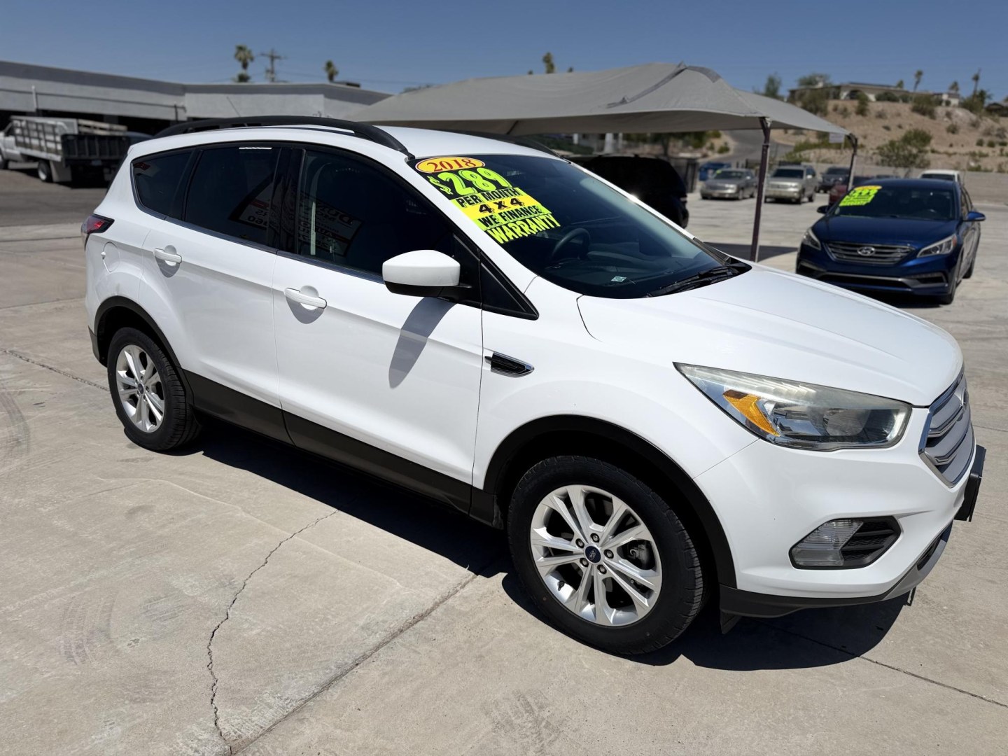 2018 White Ford Escape SE 4WD (1FMCU9GD2JU) with an 1.5L L4 DOHC 16V engine, 6A transmission, located at 2190 Hwy 95, Bullhead City, AZ, 86442, (928) 704-0060, 0.000000, 0.000000 - 2018 Ford Escape Se. 4 wheel drive. 1 owner. local Arizona car. Free carfax, free warranty. In house financing available. Runs and drives great.- Photo#1