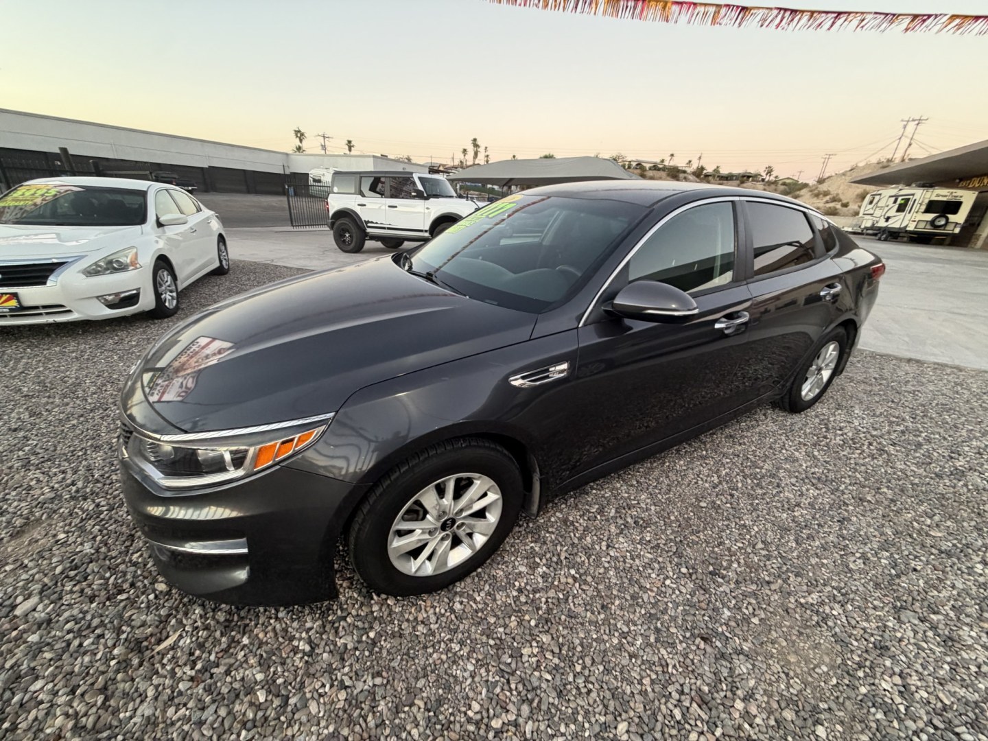 2016 Charcoal Kia Optima , located at 2190 Hwy 95, Bullhead City, AZ, 86442, (928) 704-0060, 0.000000, 0.000000 - 2016 Kia optima LX . 2.4 i4 engine . Newer engine recently installed with warranty only 80k on engine . Complete safety and serviced .- Photo#2
