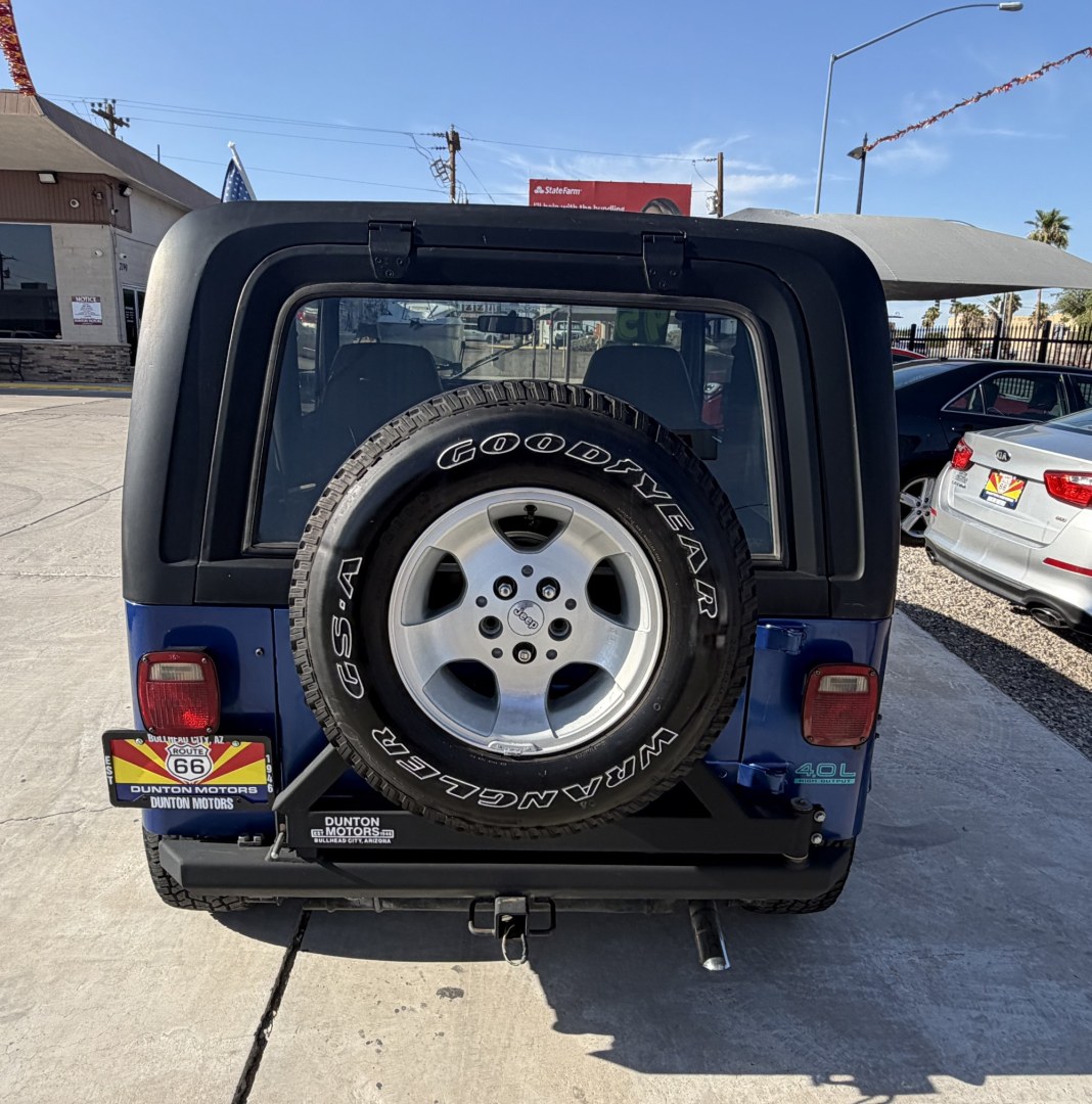1995 Jeep Wrangler SE (1J4FY29S9SP) with an 4.0L L6 OHV 12V engine, located at 2190 Hwy 95, Bullhead City, AZ, 86442, (928) 704-0060, 0.000000, 0.000000 - 1995 jeep wrangler 6 cylinder automatic transmission 4 wheel drive. hard top with air conditioning. swing away spare tire carrier. hard top, hard doors. great running jeep. new shocks all the way around. brake pads, completely serviced. free carfax, free warranty. IN house financing available.- Photo#4