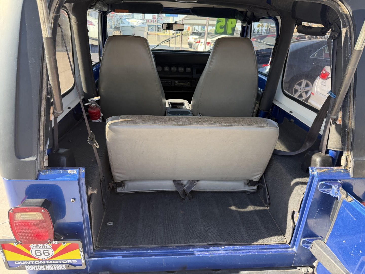 1995 Jeep Wrangler SE (1J4FY29S9SP) with an 4.0L L6 OHV 12V engine, located at 2190 Hwy 95, Bullhead City, AZ, 86442, (928) 704-0060, 0.000000, 0.000000 - 1995 jeep wrangler 6 cylinder automatic transmission 4 wheel drive. hard top with air conditioning. swing away spare tire carrier. hard top, hard doors. great running jeep. new shocks all the way around. brake pads, completely serviced. free carfax, free warranty. IN house financing available.- Photo#5