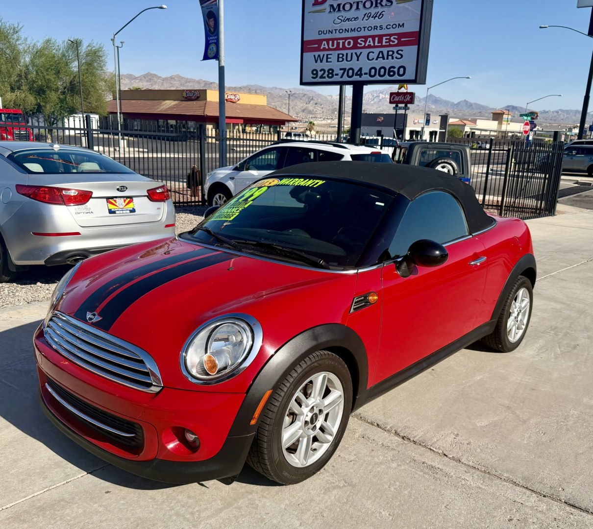 2013 ruby red Mini Cooper Base (WMWSY1C57DT) with an 1.6L L4 DOHC 16V TURBO engine, located at 2190 Hwy 95, Bullhead City, AZ, 86442, (928) 704-0060, 0.000000, 0.000000 - automatic convertible. great running cool car.- Photo#0