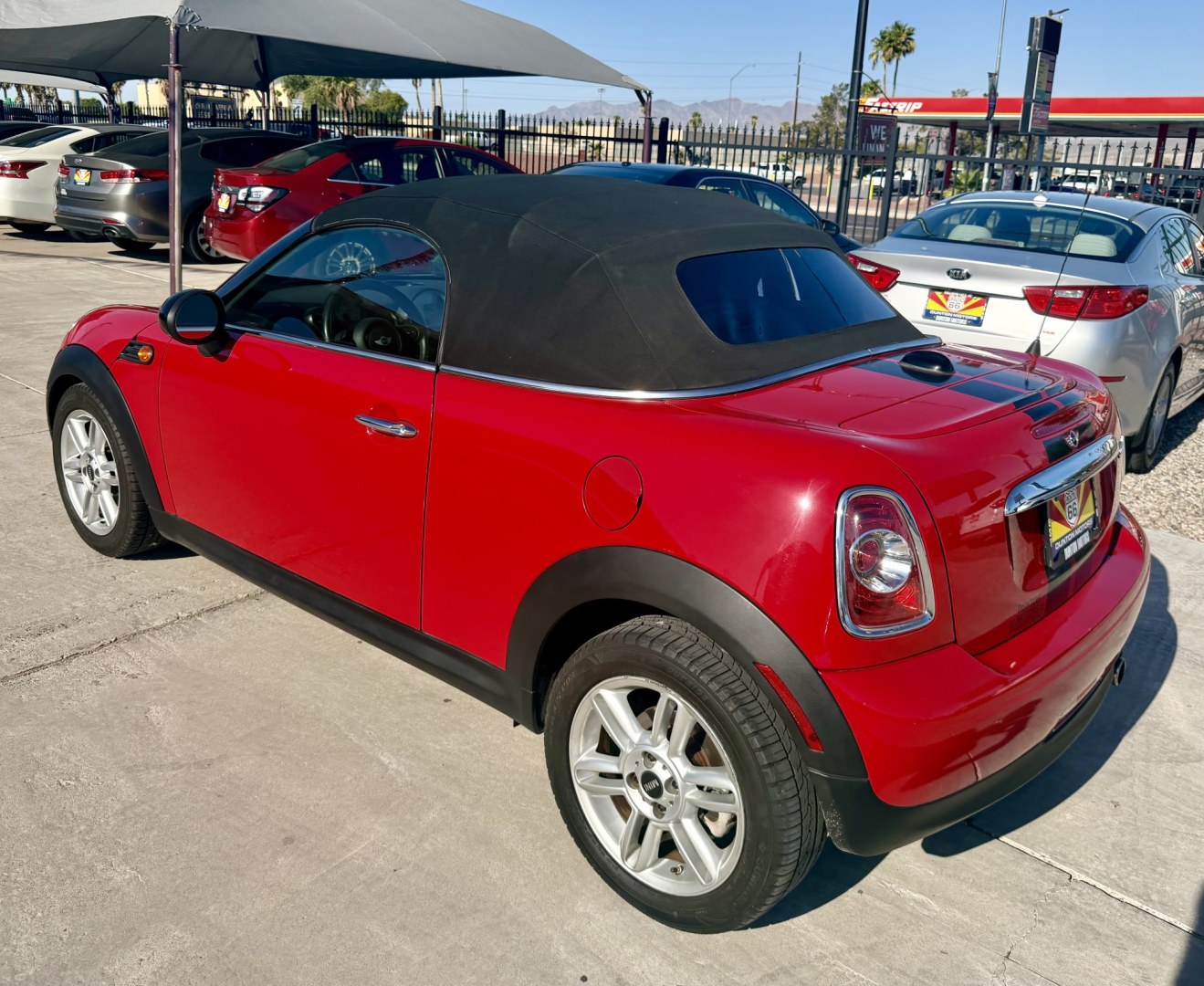 2013 ruby red Mini Cooper Base (WMWSY1C57DT) with an 1.6L L4 DOHC 16V TURBO engine, located at 2190 Hwy 95, Bullhead City, AZ, 86442, (928) 704-0060, 0.000000, 0.000000 - automatic convertible. great running cool car.- Photo#3