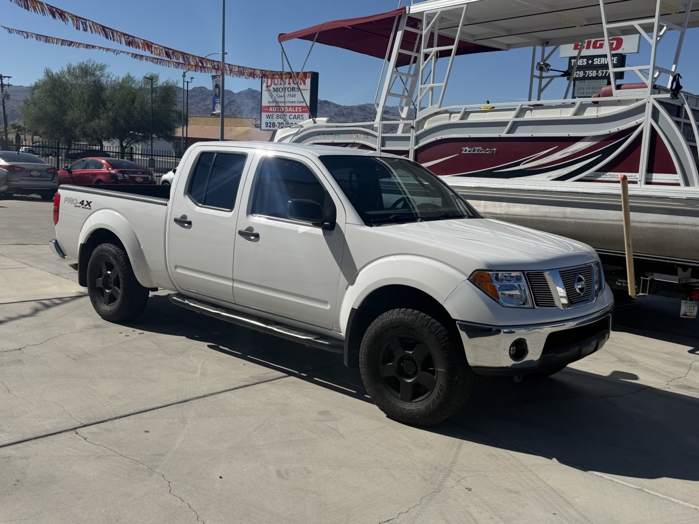 2008 White , located at 2190 Hwy 95, Bullhead City, AZ, 86442, (928) 704-0060, 0.000000, 0.000000 - 2008 Nissan Frontier Crew cab 4x4.SE V6 pro 4Xoff road package. automatic . toyo all terrain off road tires. custom running boards. new headlights. recently serviced. ice cold a/c. small body lift with off road tires/wheels. bedliner tow package. always garaged. elderly owned. This truck looks new.- Photo#3