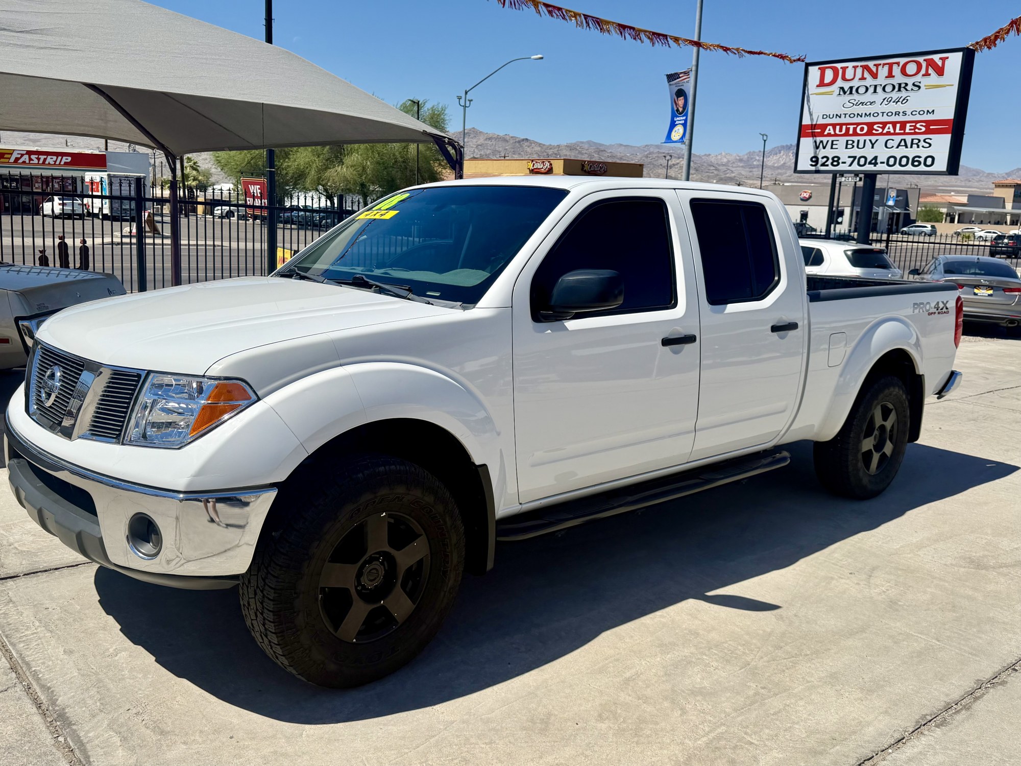 photo of 2008 Nissan frontier crew cab 4X4 lift tires / wheels. 