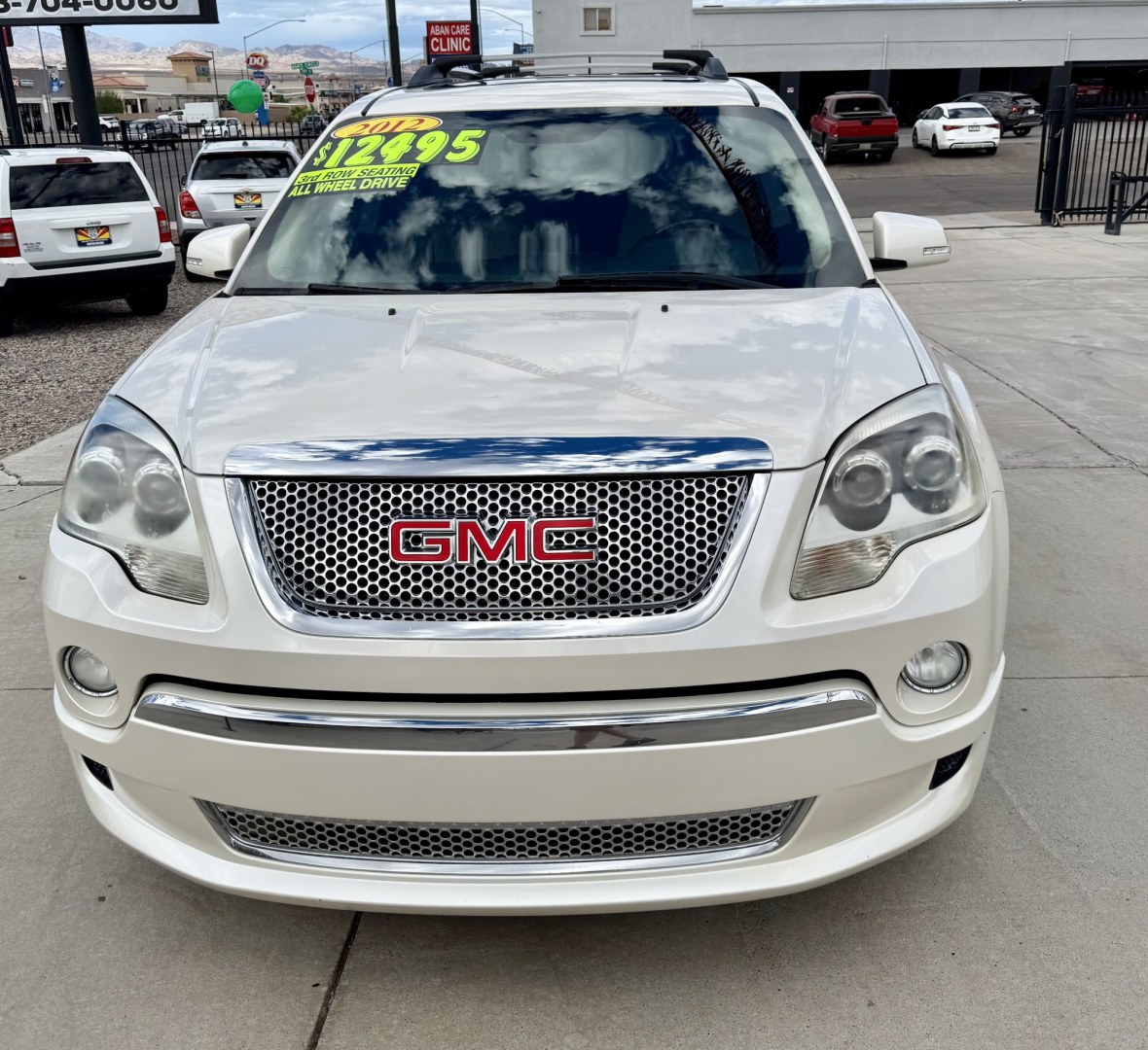 2012 White GMC Acadia Denali FWD (1GKKRTED4CJ) with an 3.6L V6 DOHC 24V engine, 6A transmission, located at 2190 Hwy 95, Bullhead City, AZ, 86442, (928) 704-0060, 0.000000, 0.000000 - 2012 GMC Acadia Denali. fully loaded .3rd row leatherk moonroof, backup camera, bluetooth, dual rear tv's with dvd player. michelin tires. completely serviced. In house financing available. loaded we finance. Free carfax, free warranty.- Photo#2