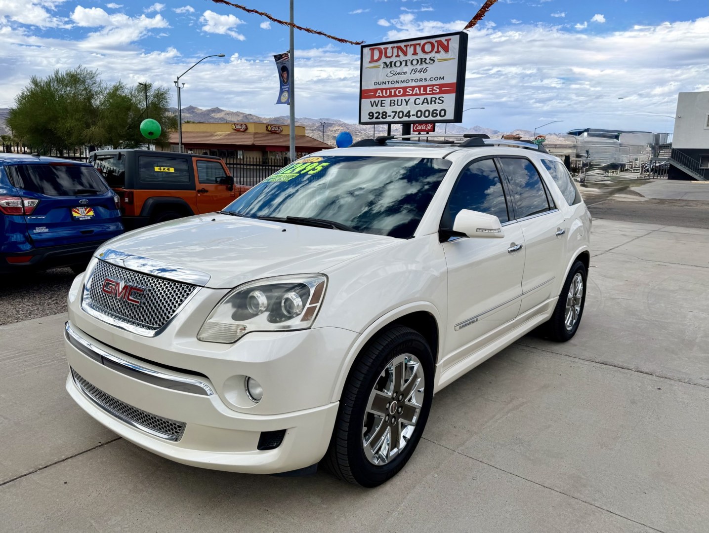 2012 White GMC Acadia Denali FWD (1GKKRTED4CJ) with an 3.6L V6 DOHC 24V engine, 6A transmission, located at 2190 Hwy 95, Bullhead City, AZ, 86442, (928) 704-0060, 0.000000, 0.000000 - 2012 GMC Acadia Denali. fully loaded .3rd row leatherk moonroof, backup camera, bluetooth, dual rear tv's with dvd player. michelin tires. completely serviced. In house financing available. loaded we finance. Free carfax, free warranty.- Photo#1