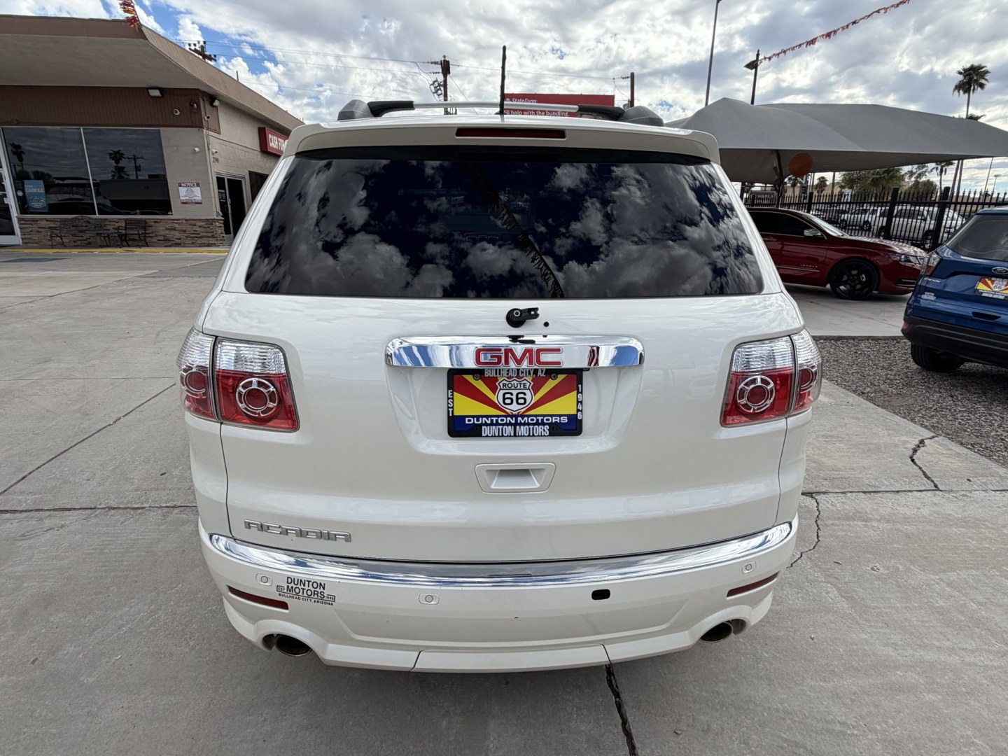 2012 White GMC Acadia Denali FWD (1GKKRTED4CJ) with an 3.6L V6 DOHC 24V engine, 6A transmission, located at 2190 Hwy 95, Bullhead City, AZ, 86442, (928) 704-0060, 0.000000, 0.000000 - 2012 GMC Acadia Denali. fully loaded .3rd row leatherk moonroof, backup camera, bluetooth, dual rear tv's with dvd player. michelin tires. completely serviced. In house financing available. loaded we finance. Free carfax, free warranty.- Photo#3
