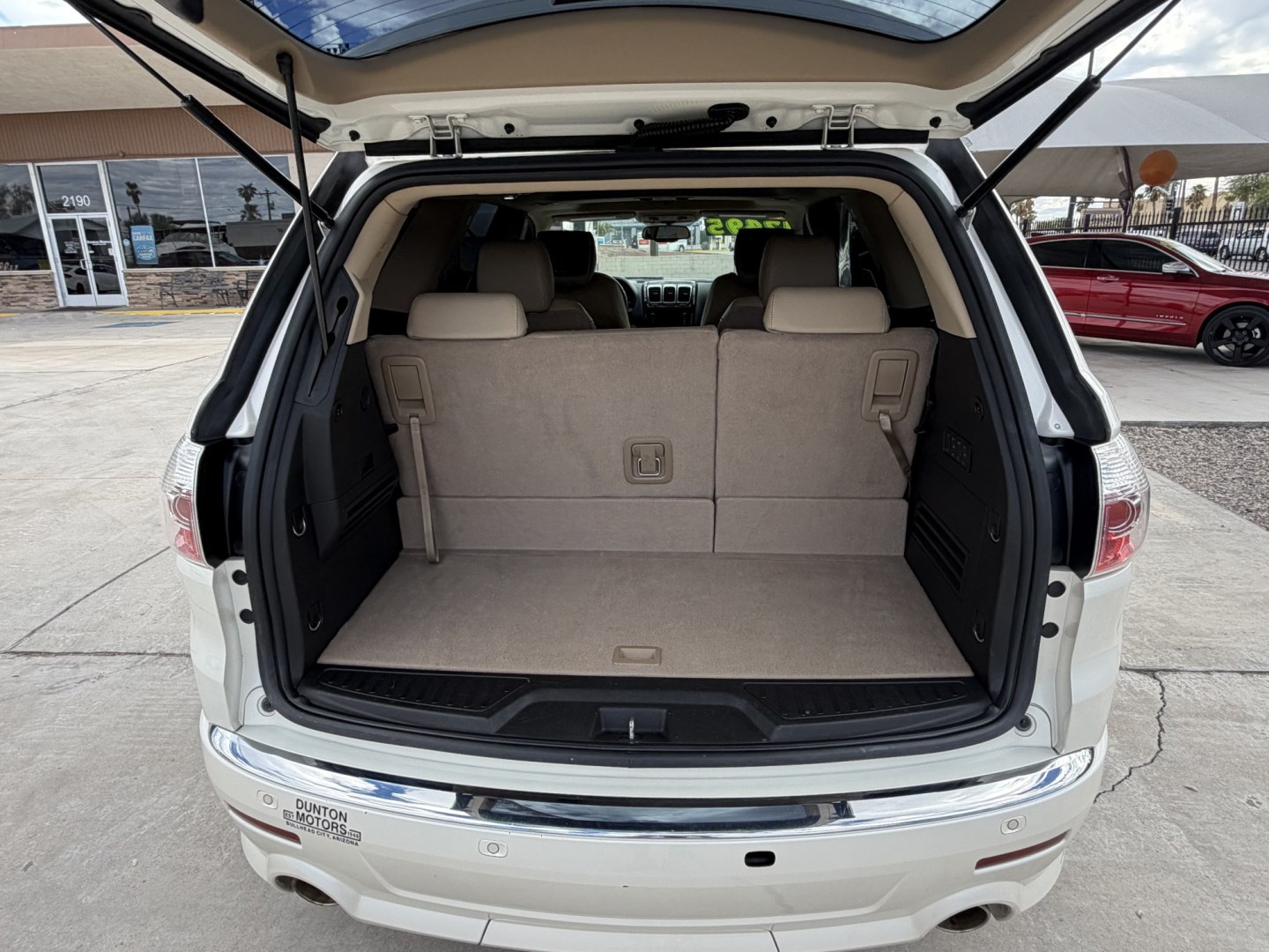 2012 White GMC Acadia Denali FWD (1GKKRTED4CJ) with an 3.6L V6 DOHC 24V engine, 6A transmission, located at 2190 Hwy 95, Bullhead City, AZ, 86442, (928) 704-0060, 0.000000, 0.000000 - 2012 GMC Acadia Denali. fully loaded .3rd row leatherk moonroof, backup camera, bluetooth, dual rear tv's with dvd player. michelin tires. completely serviced. In house financing available. loaded we finance. Free carfax, free warranty.- Photo#5