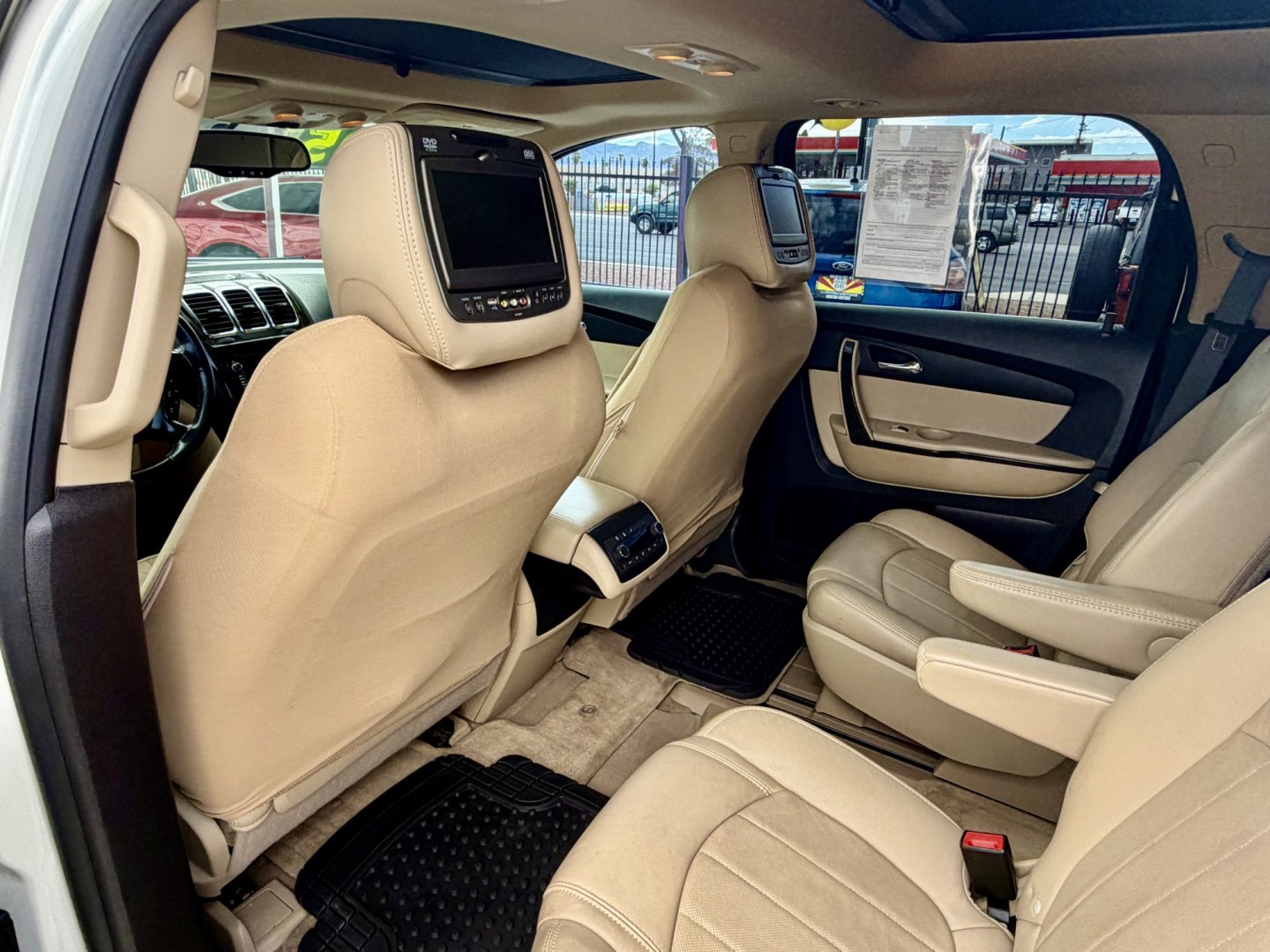 2012 White GMC Acadia Denali FWD (1GKKRTED4CJ) with an 3.6L V6 DOHC 24V engine, 6A transmission, located at 2190 Hwy 95, Bullhead City, AZ, 86442, (928) 704-0060, 0.000000, 0.000000 - 2012 GMC Acadia Denali. fully loaded .3rd row leatherk moonroof, backup camera, bluetooth, dual rear tv's with dvd player. michelin tires. completely serviced. In house financing available. loaded we finance. Free carfax, free warranty.- Photo#6
