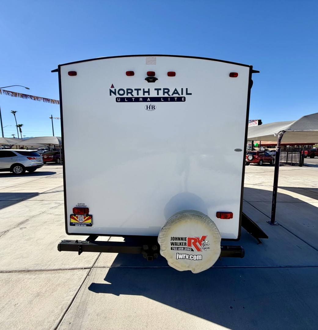 2021 White Heartland North Trail Ultra Lite (5AFNB2621MN) , located at 2190 Hwy 95, Bullhead City, AZ, 86442, (928) 704-0060, 0.000000, 0.000000 - 2021 Heartland North trail boss. 26.6 ft long. power awning. rear bathroom . sleeps 4 . king size bed. brand new batteries. electric tongue jack. fully equipped kitchen power slide out. heated and enclosed under belly. outside shower. large pass through storage. power awning with led lighthing. sol- Photo#11