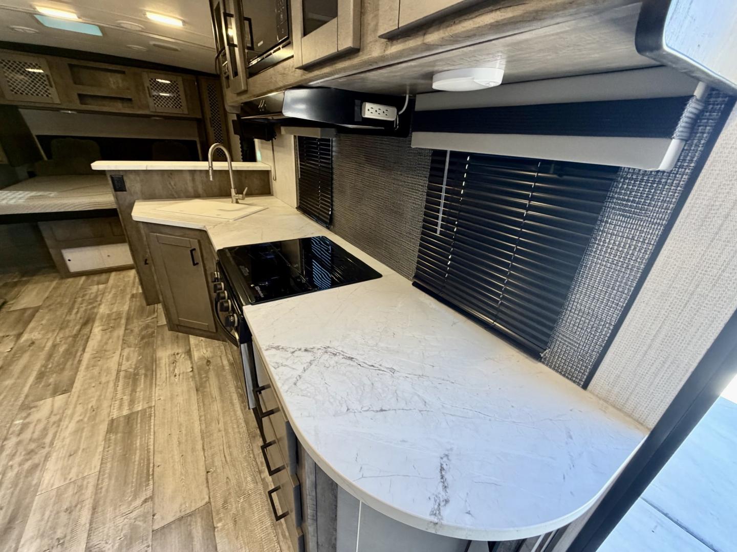 2021 White Heartland North Trail Ultra Lite (5AFNB2621MN) , located at 2190 Hwy 95, Bullhead City, AZ, 86442, (928) 704-0060, 0.000000, 0.000000 - 2021 Heartland North trail boss. 26.6 ft long. power awning. rear bathroom . sleeps 4 . king size bed. brand new batteries. electric tongue jack. fully equipped kitchen power slide out. heated and enclosed under belly. outside shower. large pass through storage. power awning with led lighthing. sol- Photo#26